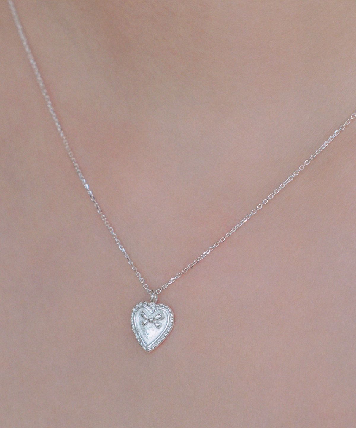 포스트루드(POSTLUDE) [SILVER] HEART MINI RIBBON PENDANT N
