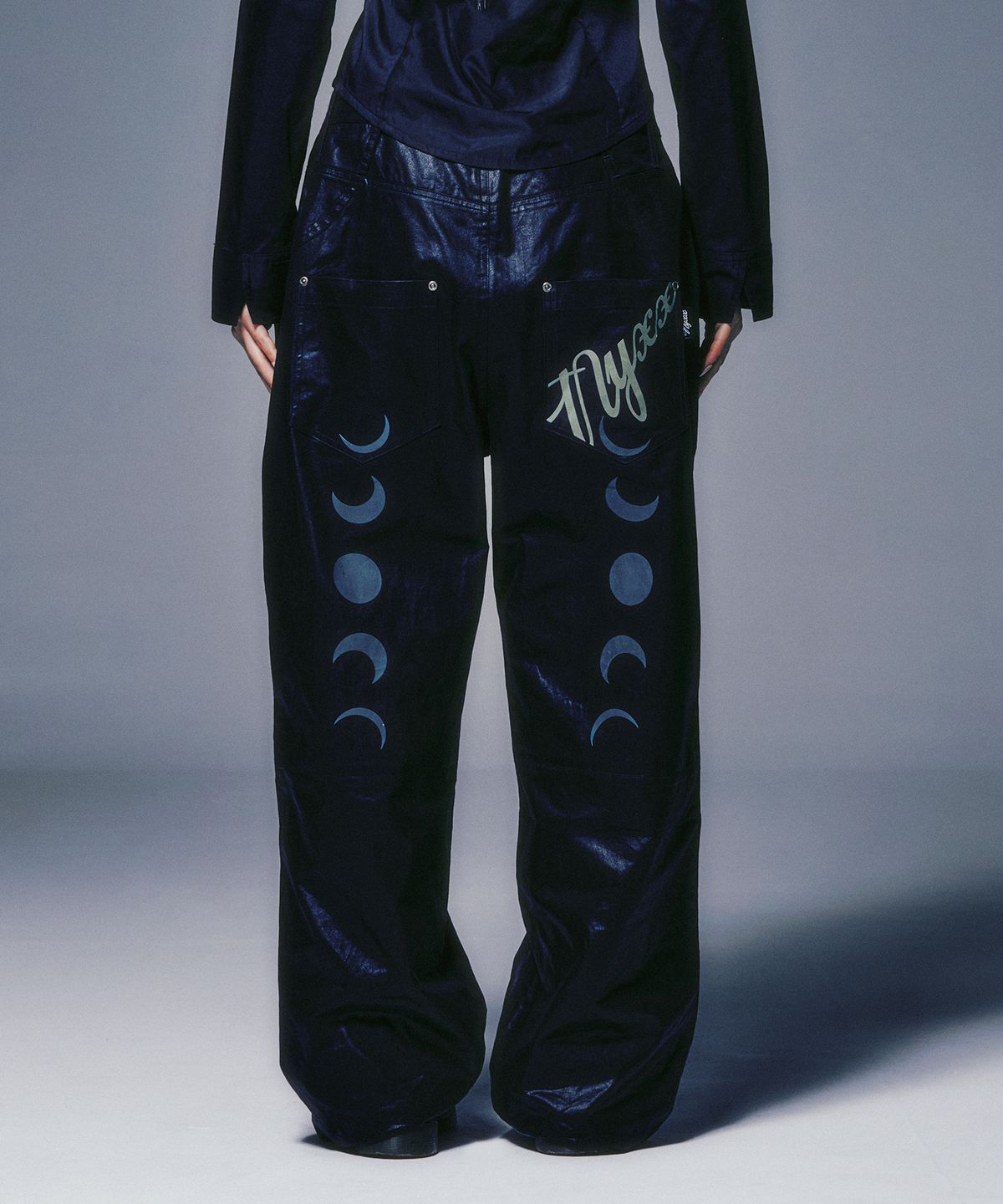 엔와이엑스엑스(NYXX) STRAP BELTED FAUX LEATHER PANTS BLACK