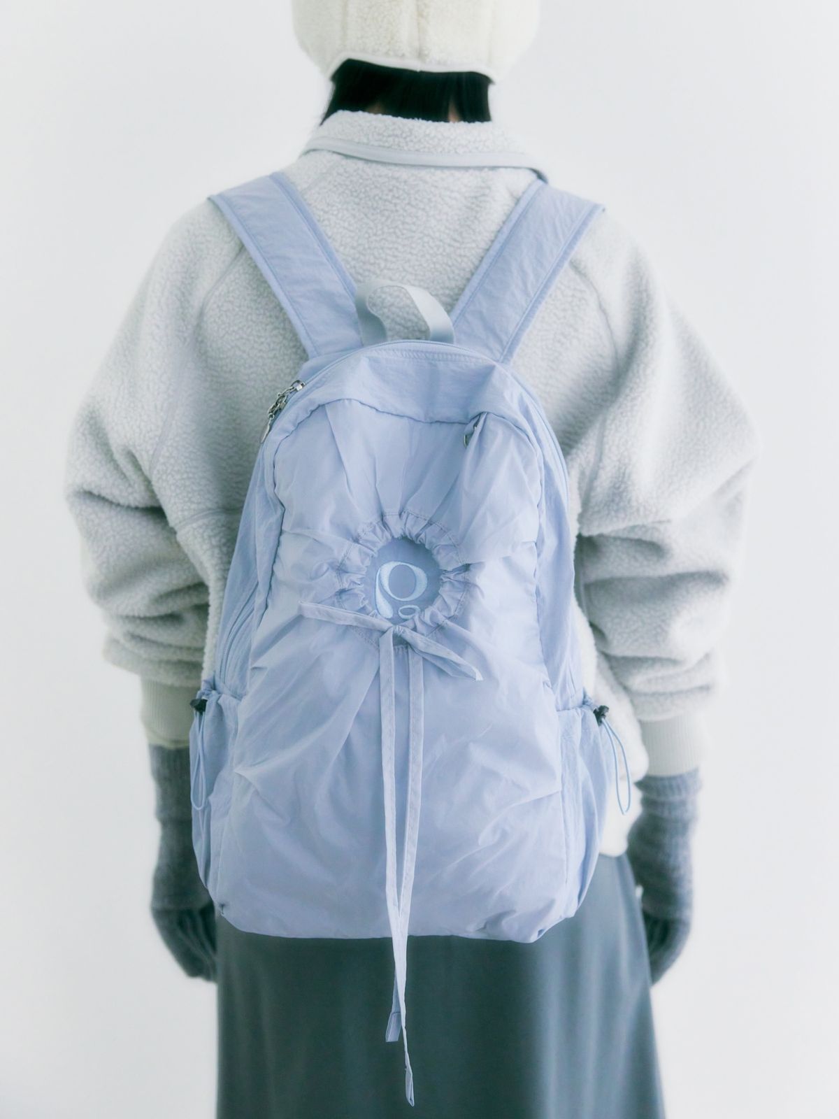 포이에(POIE) hole string PO backpack (blue gray)