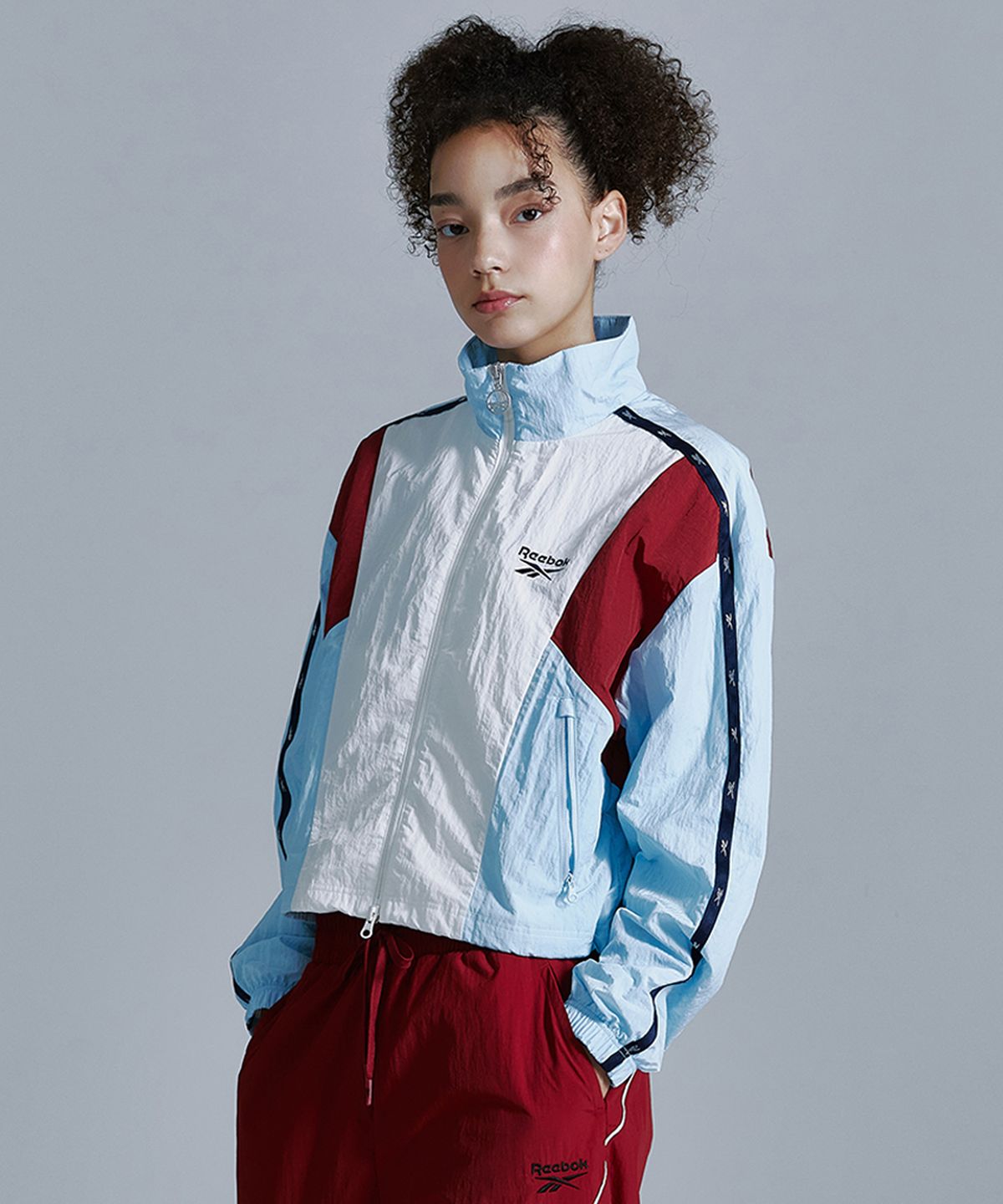 리복(REEBOK) 라이벌 크롭 윈드 브레이커 (W) - 블루