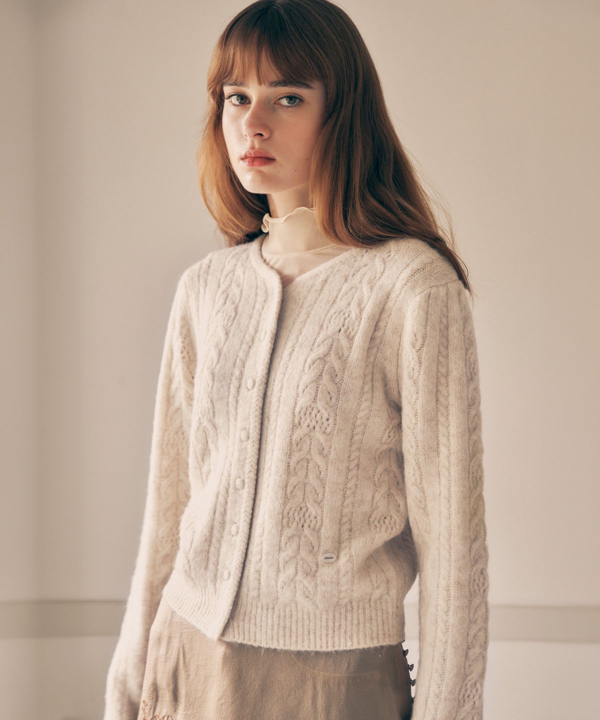 로라로라(ROLAROLA) PUFF SLEEVE CABLE CARDIGAN IVORY