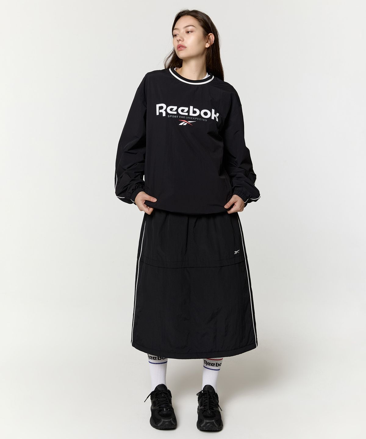 리복(REEBOK) 파라슈트 패딩 스커트 (W) - 블랙