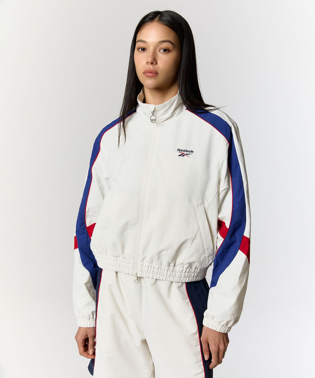 리복(REEBOK) 레전드 웜업 크롭 윈드 브레이커 (W)  - 화이트