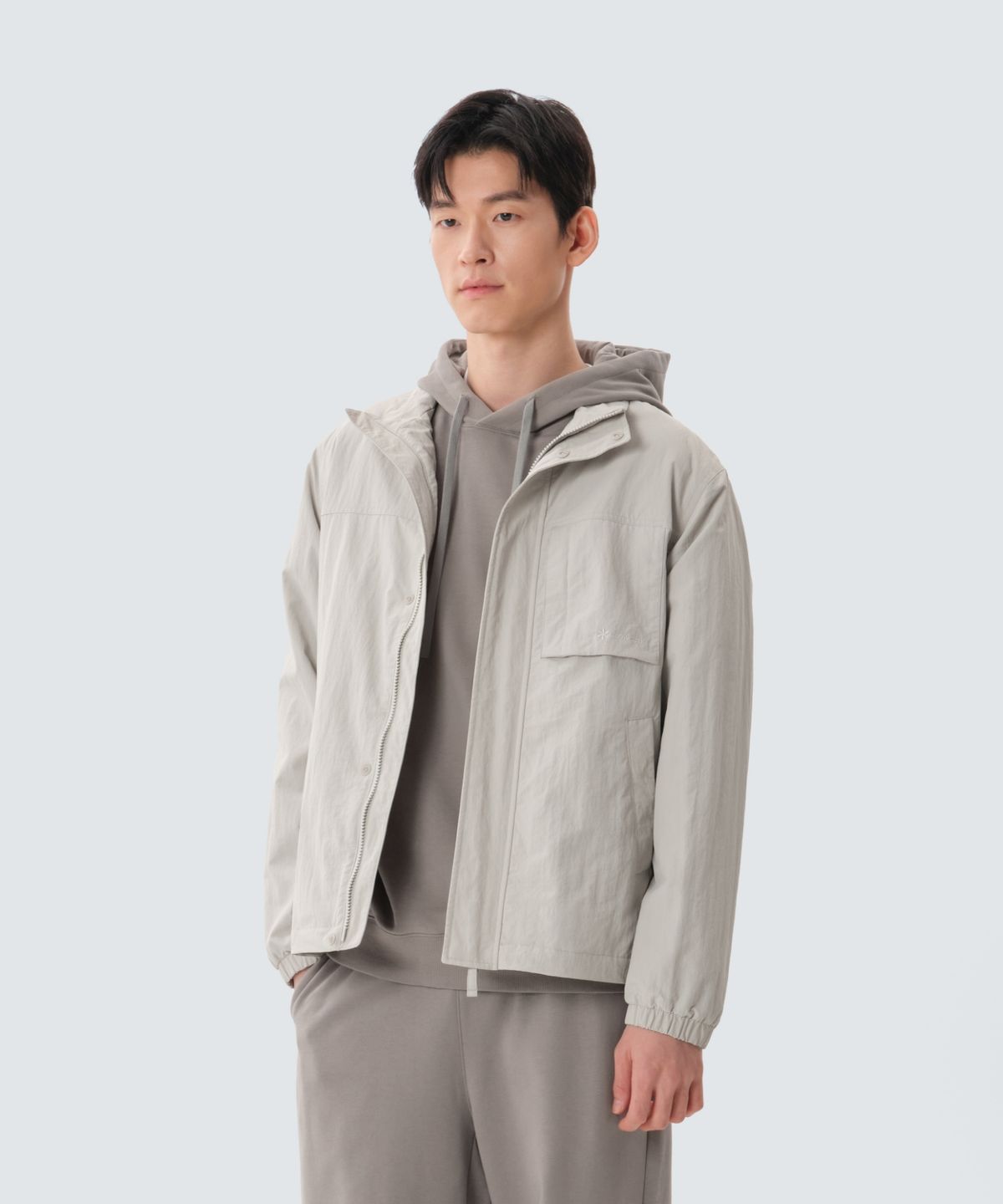 스노우피크 어패럴(SNOWPEAK APPAREL) 캠플 스탠드넥 바람막이 (S25SMCWB12) Light Beige