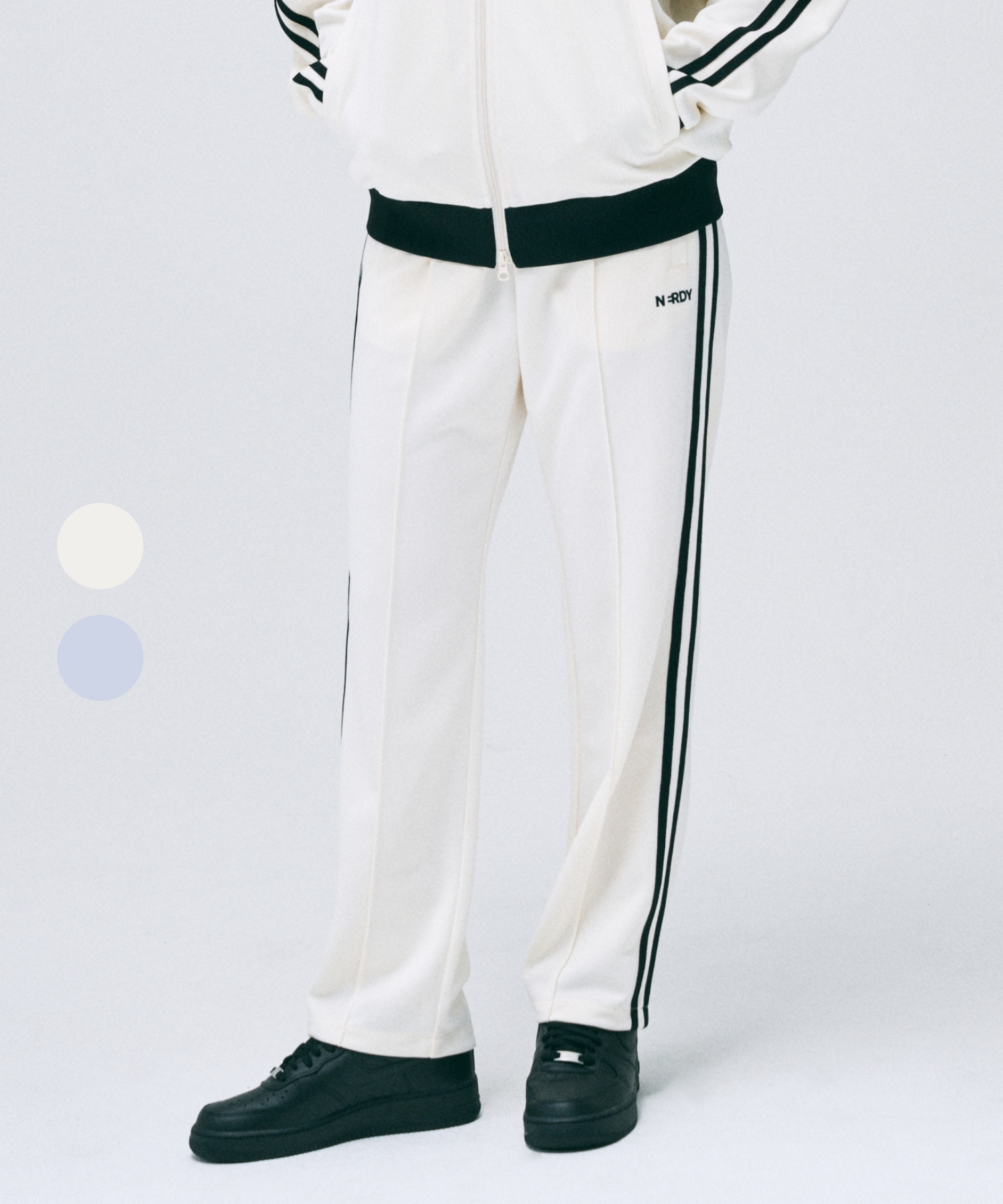 MUSINSA | NERDY Classic NY Track Pants (25SS) (Cream/Pale Blue)