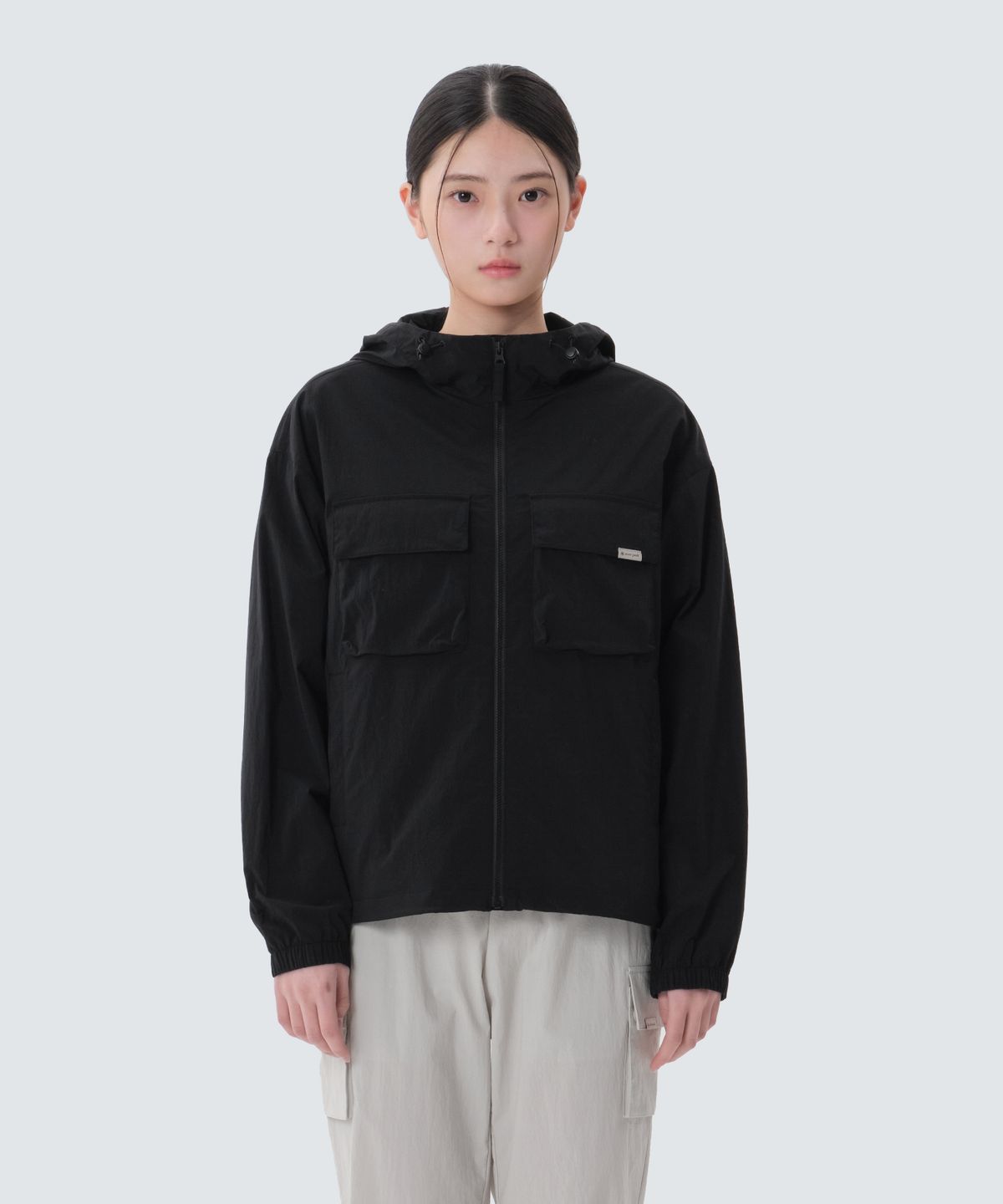스노우피크 어패럴(SNOWPEAK APPAREL) 루트 여성 포켓 바람막이 (S25MWRWB61) Black