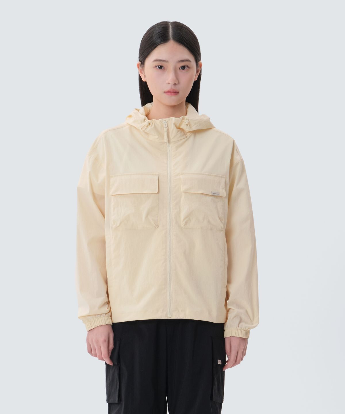 스노우피크 어패럴(SNOWPEAK APPAREL) 루트 여성 포켓 바람막이 (S25MWRWB61) Pastel Yellow