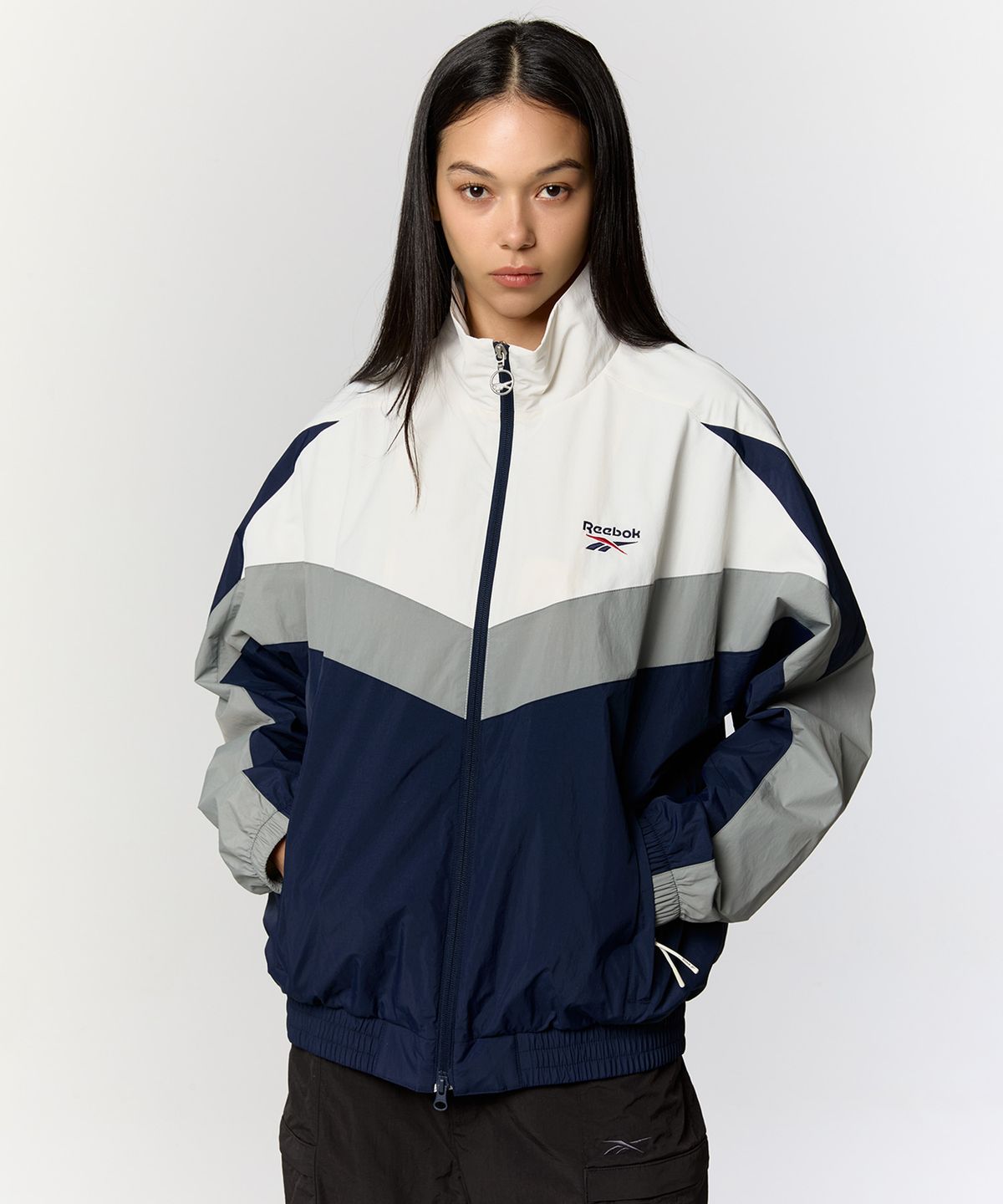 리복(REEBOK) 피스벡터 윈드 브레이커 - 화이트:네이비