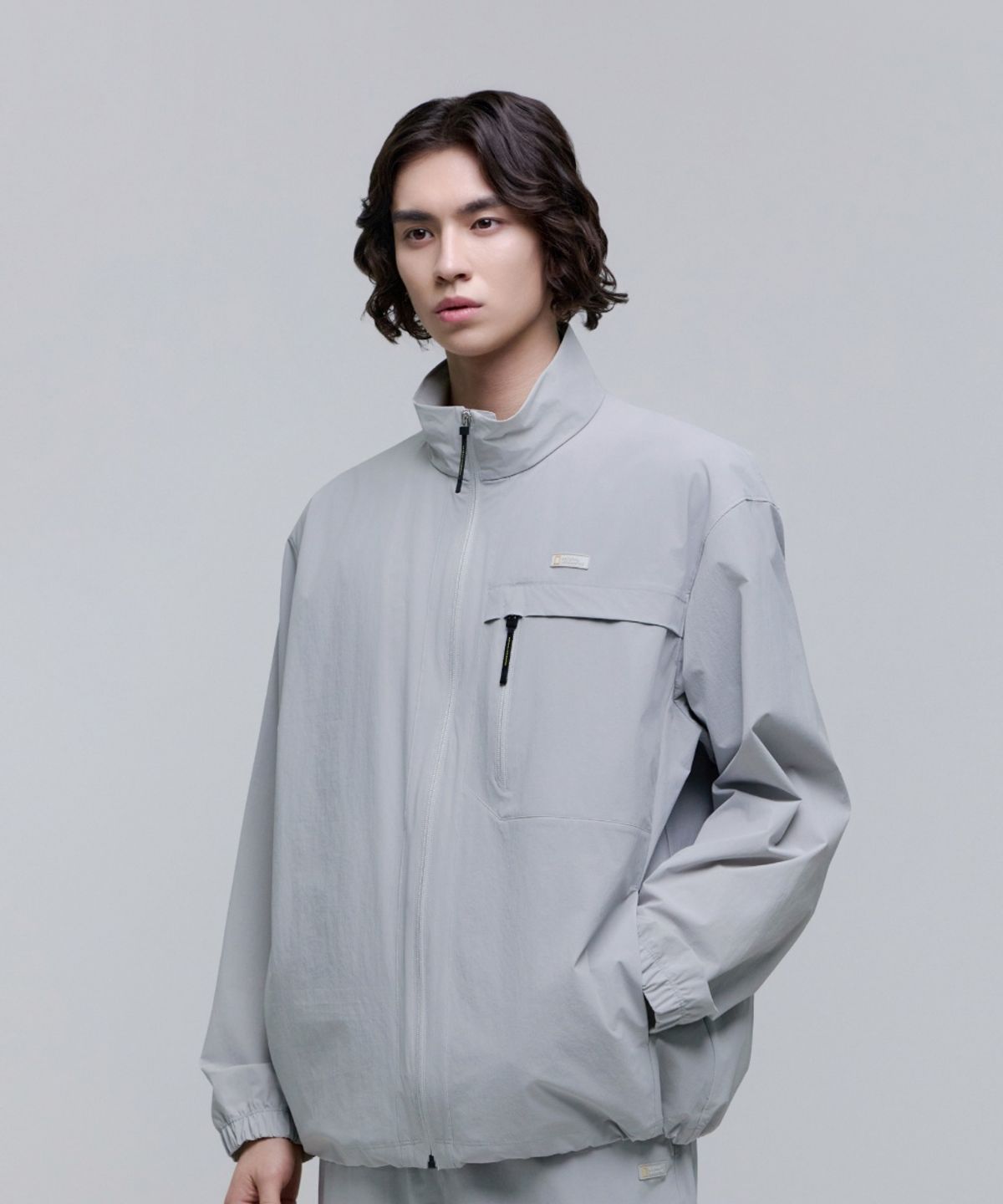 내셔널지오그래픽(NATIONALGEOGRAPHIC) N252UFT942 경량 우븐 하이넥 풀집업 SILVER GREY