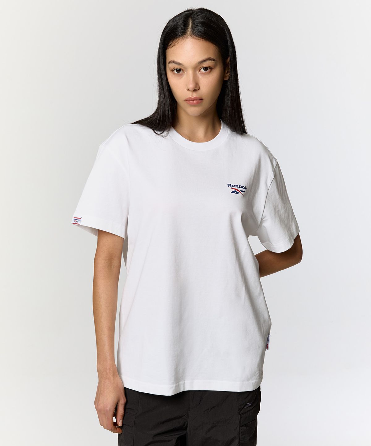 리복(REEBOK) 빅벡터 슬로건 티셔츠 - 화이트