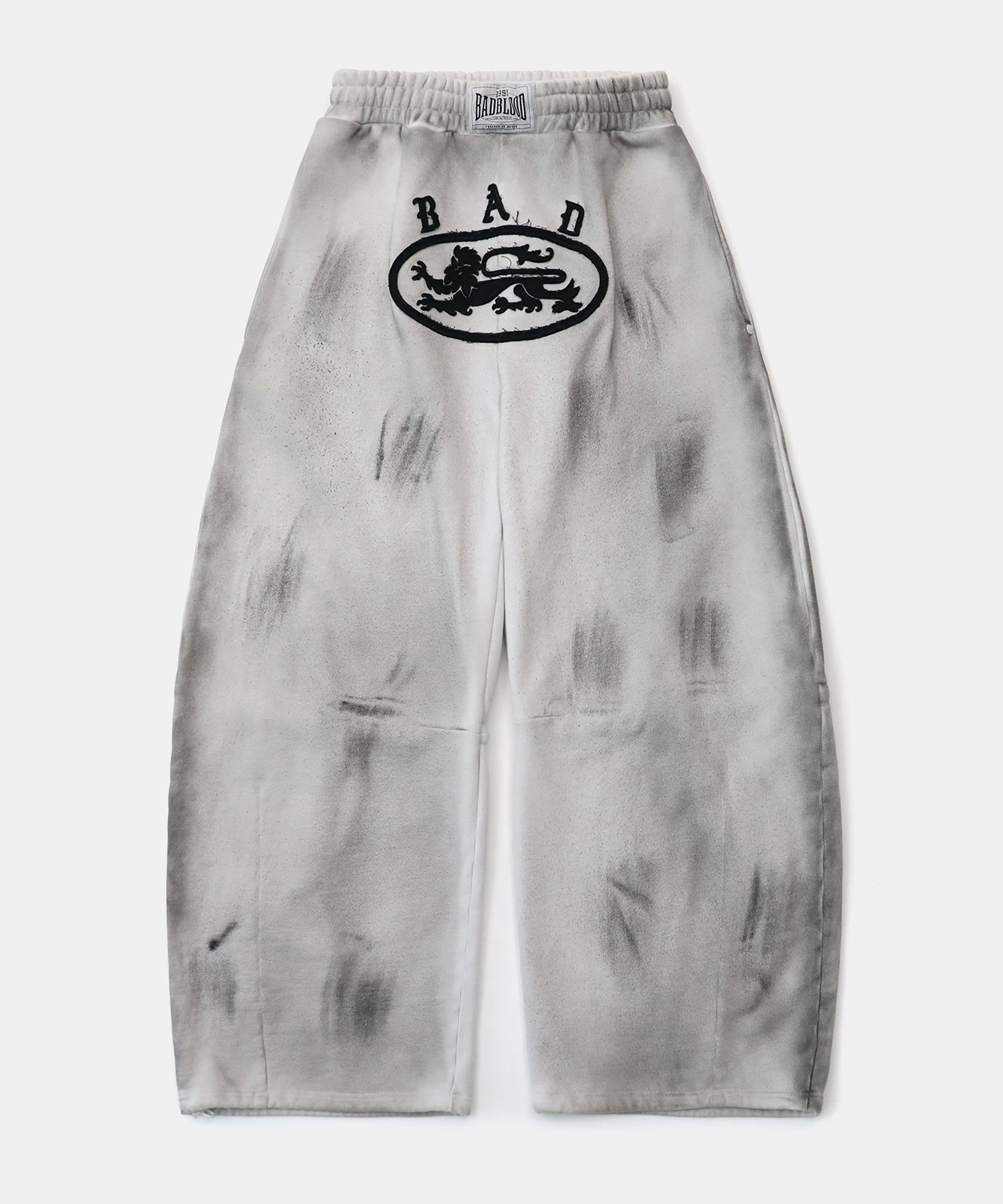 MUSINSA | BADBLOOD Lion Patch 2 Way Curved Jogger - Washed White
