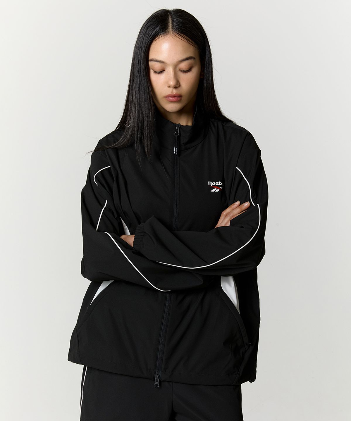 리복(REEBOK) 리바이벌 스트레치 윈드 브레이커 - 블랙
