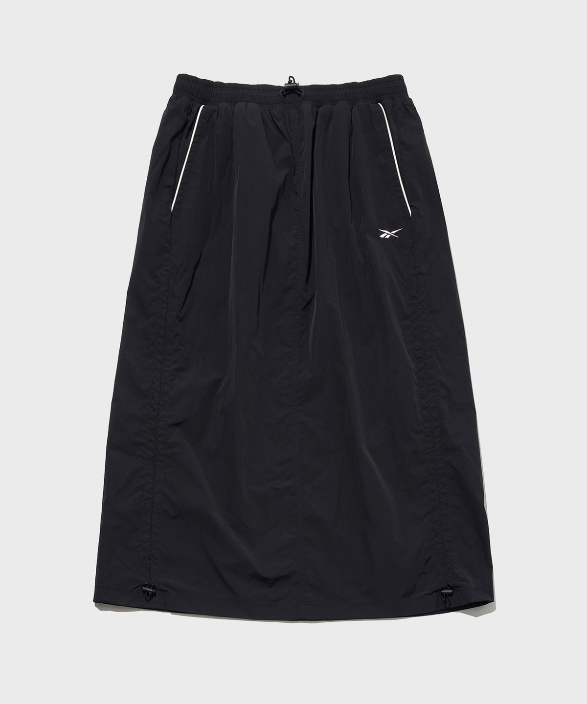 리복(REEBOK) 일립스 파라슈트 스커트 (W) - 블랙