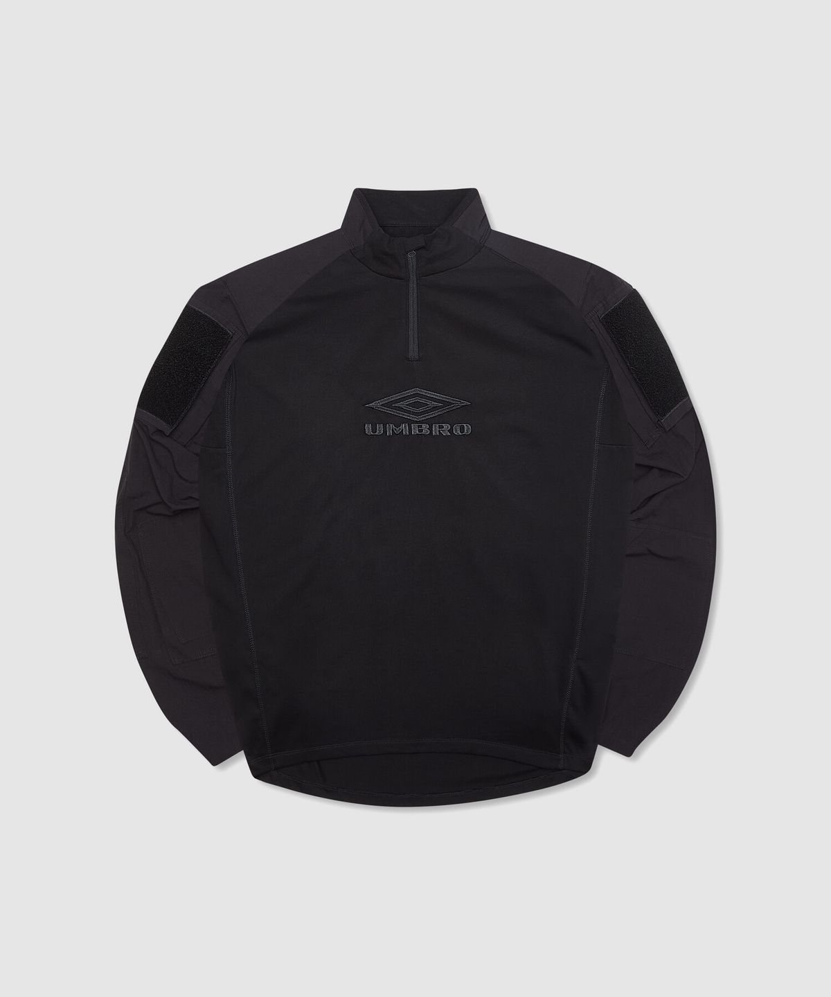 엄브로(UMBRO) [UMBRO X SLAM JAM] Tactical 반집업 긴팔 우븐탑 블랙(UQ111CWT38)