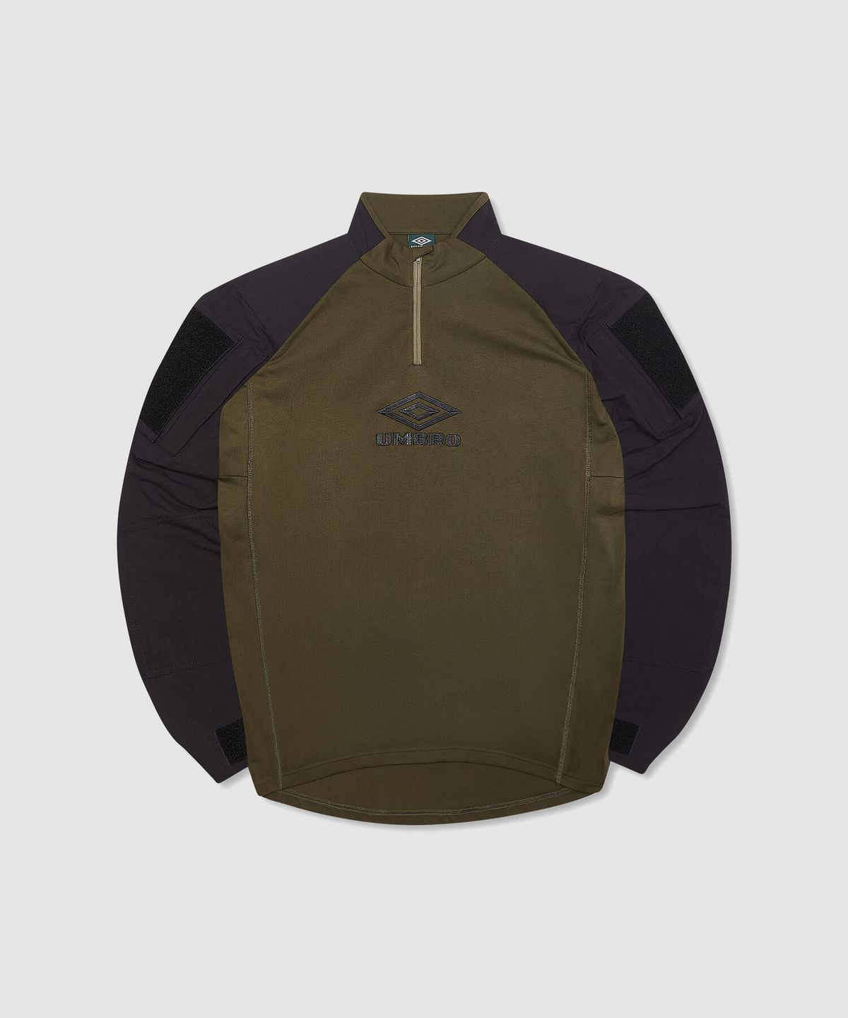 엄브로(UMBRO) [UMBRO X SLAM JAM] Tactical 반집업 긴팔 우븐탑 카키(UQ111CWT38)