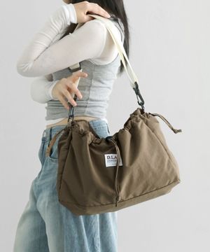 커들리 스트링 포켓 크로스백 - cocoa