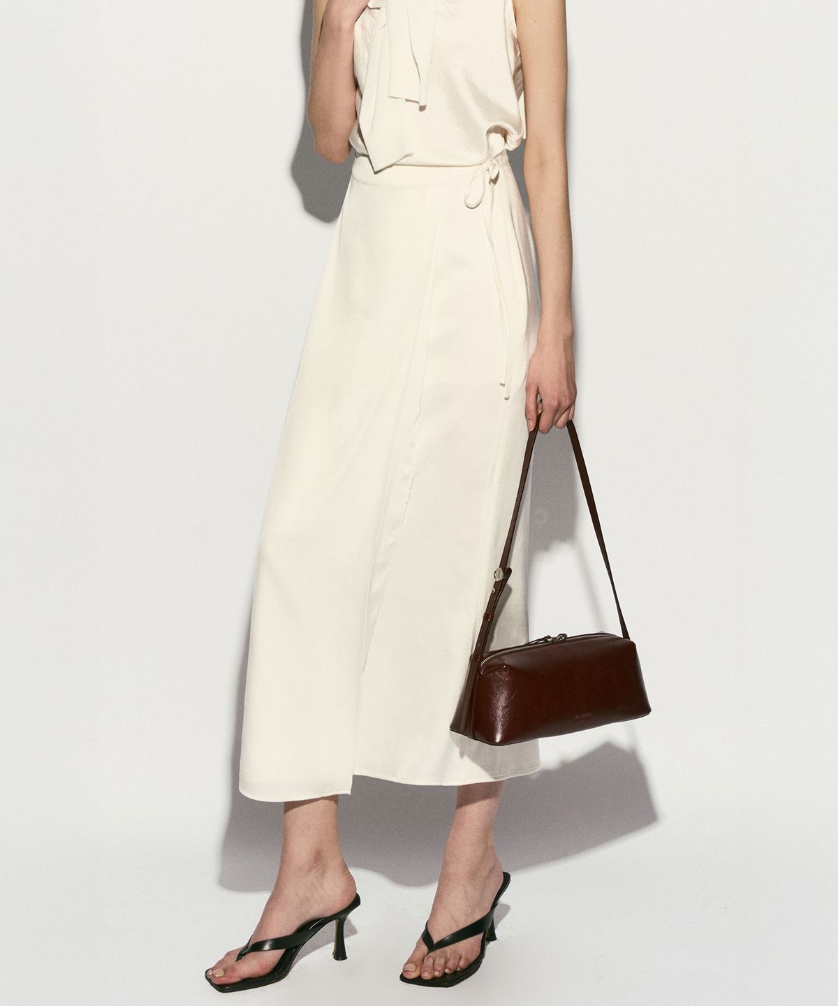 리이(RE RHEE) SILKY WRAP MIDI SKIRT PEARL