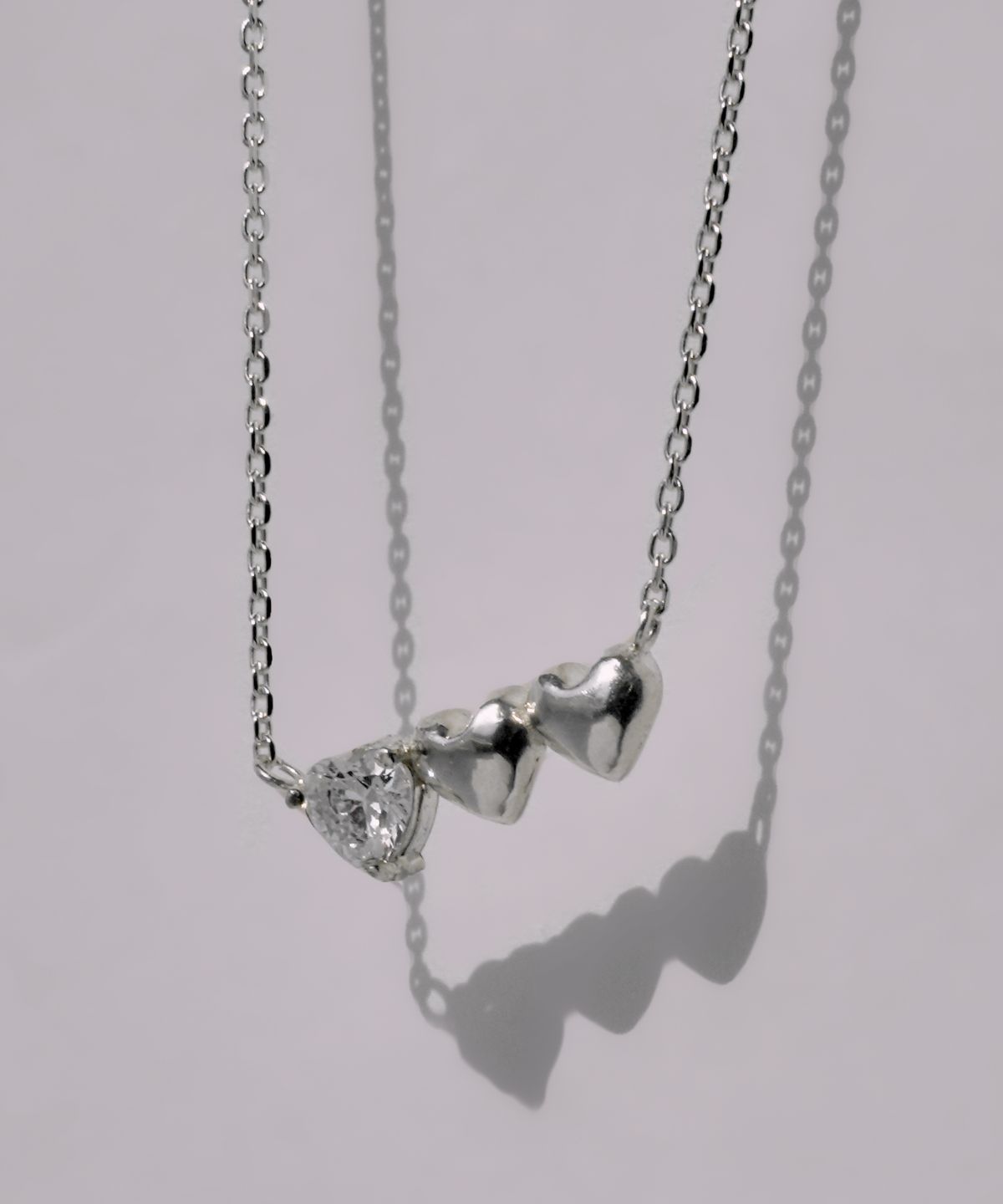 포스트루드(POSTLUDE) [SILVER] 3 HEART CZ PENDANT N (3 COLORS)