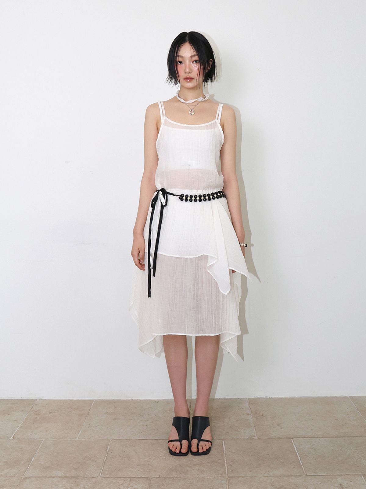 민더리(MEENDERI) SHEER ASYMMETRIC WRINKLE SKIRT - IVORY