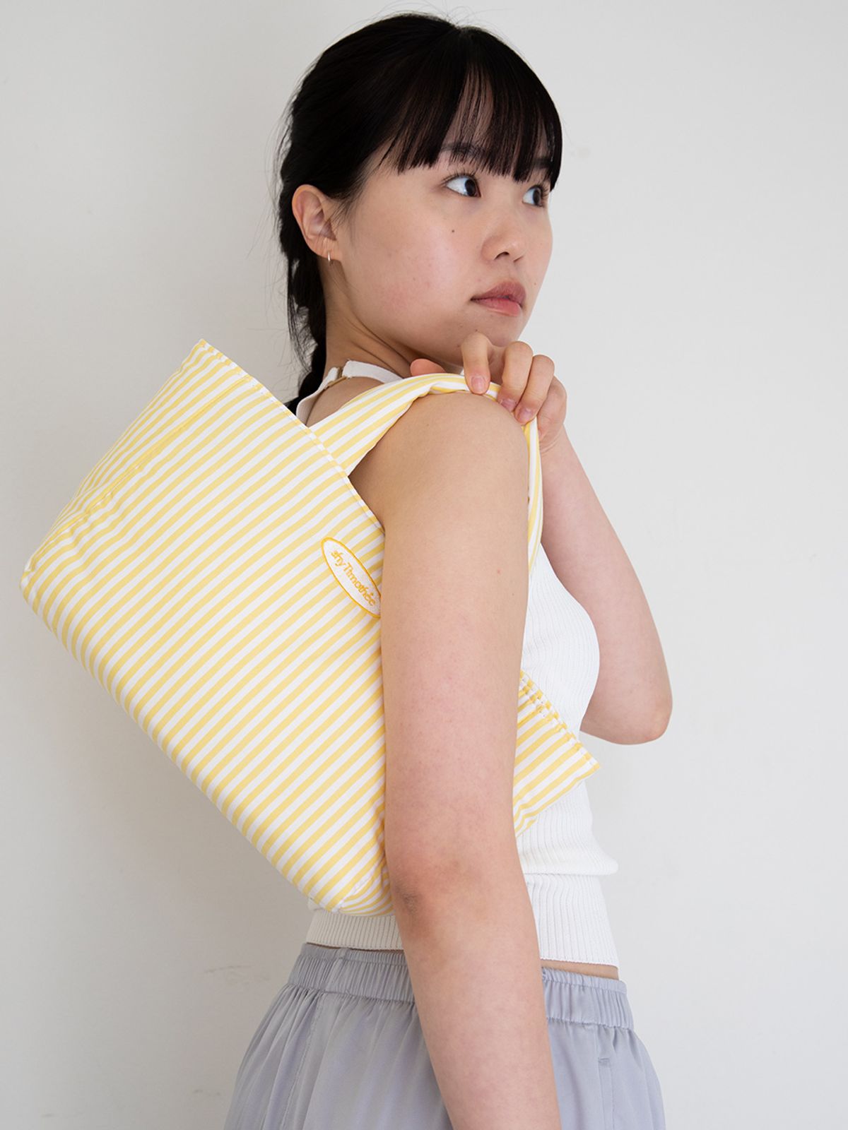 샤이티모시(SHYTIMOTHEE) stripe padded bag _yellow