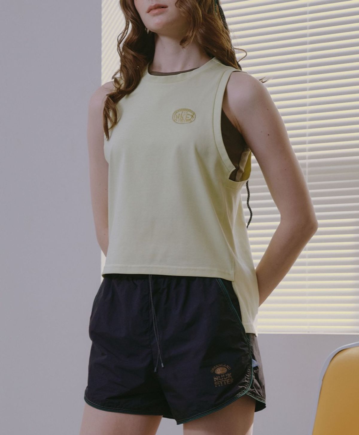 누크피터(NUUKFITTER) NKFT LAYERED SLIT SLEEVELESS_WOMEN [LEMON]