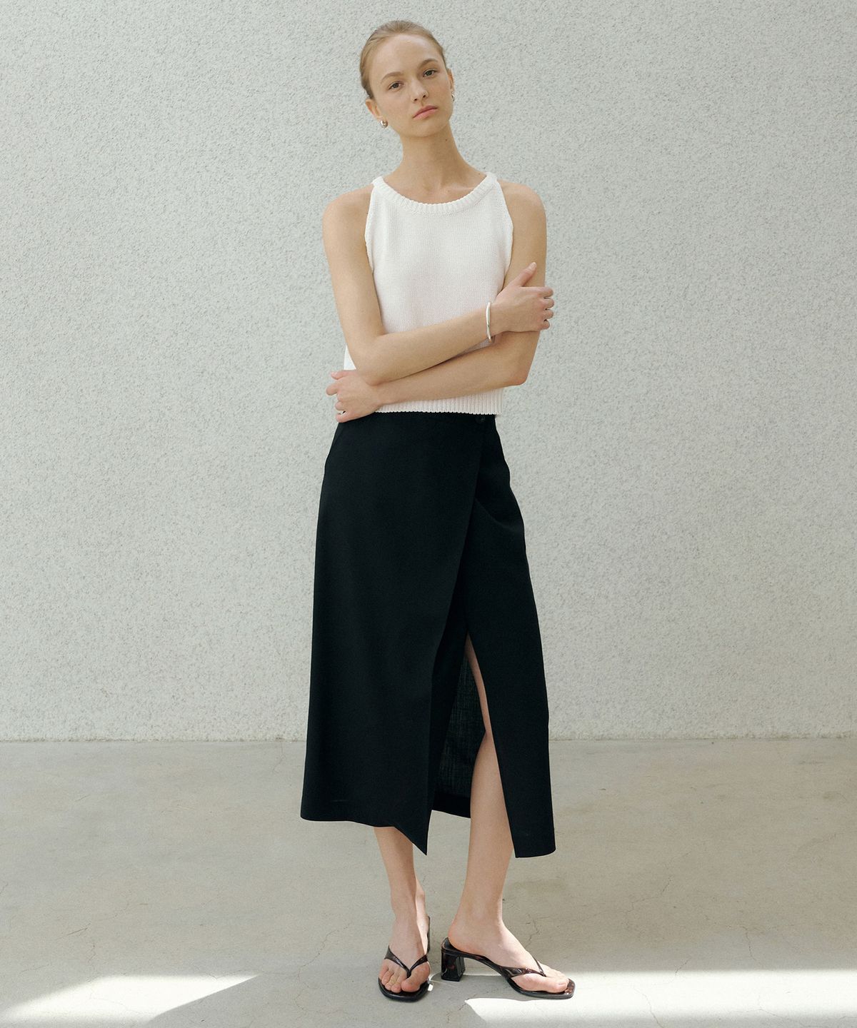 오떼뜨(OCTETTE) SUMMER-WOOL CLASSIC WRAP SKIRTS_BLACK