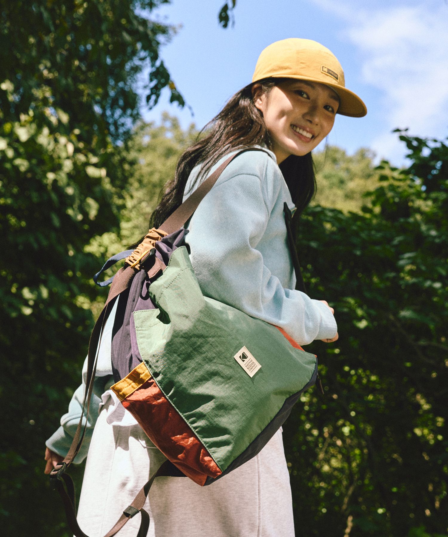 MUSINSA | KODAK Hardy Multicolor String Bucket Backpack KHAKI (20L)