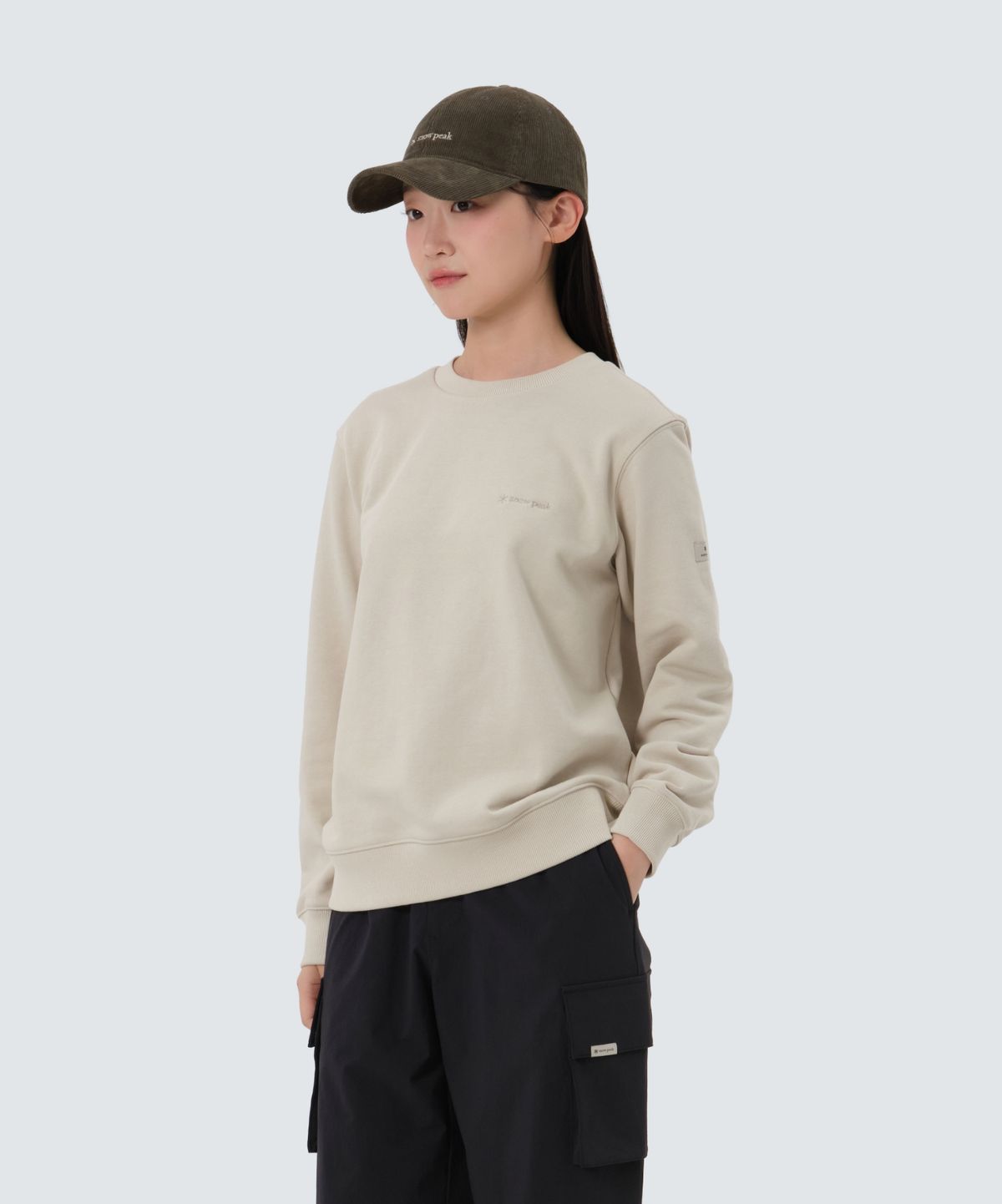 스노우피크 어패럴(SNOWPEAK APPAREL) 랜드 여성 맨투맨 (S25FWFHT61) Light Beige