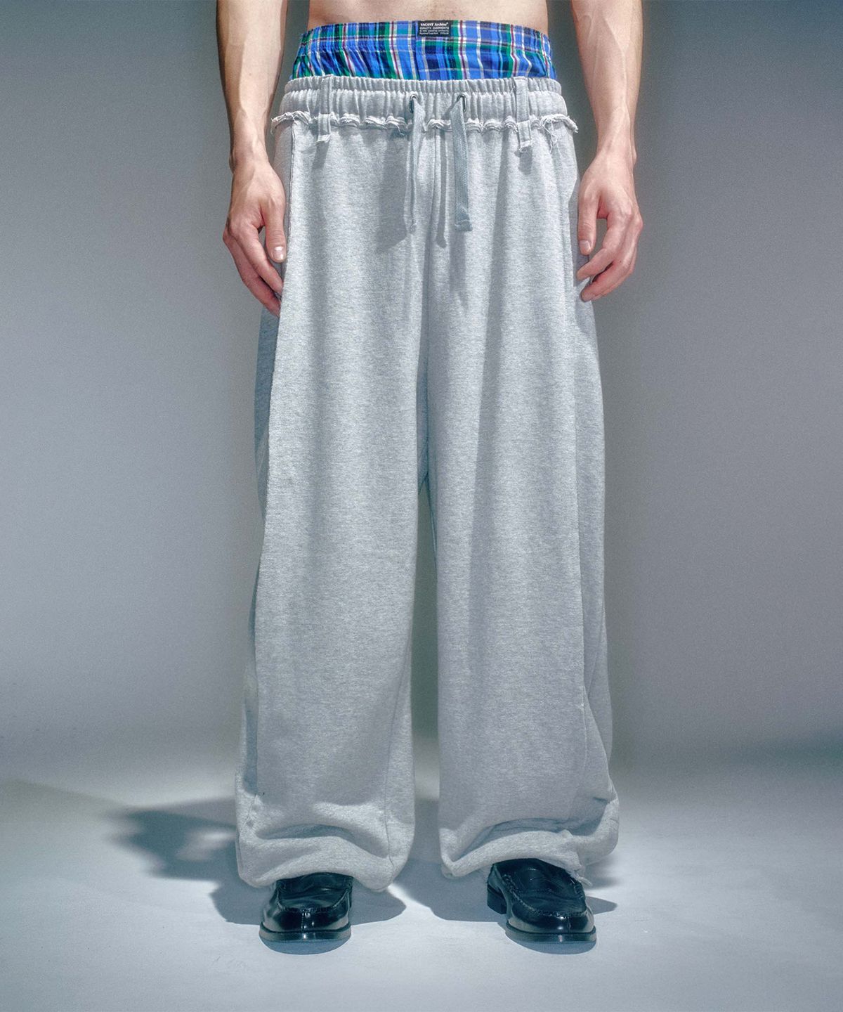 베이컨트 아카이브(VACANT ARCHIVE) MEN JOAN SEAMLINE TRACK JOGGERS MELANGE