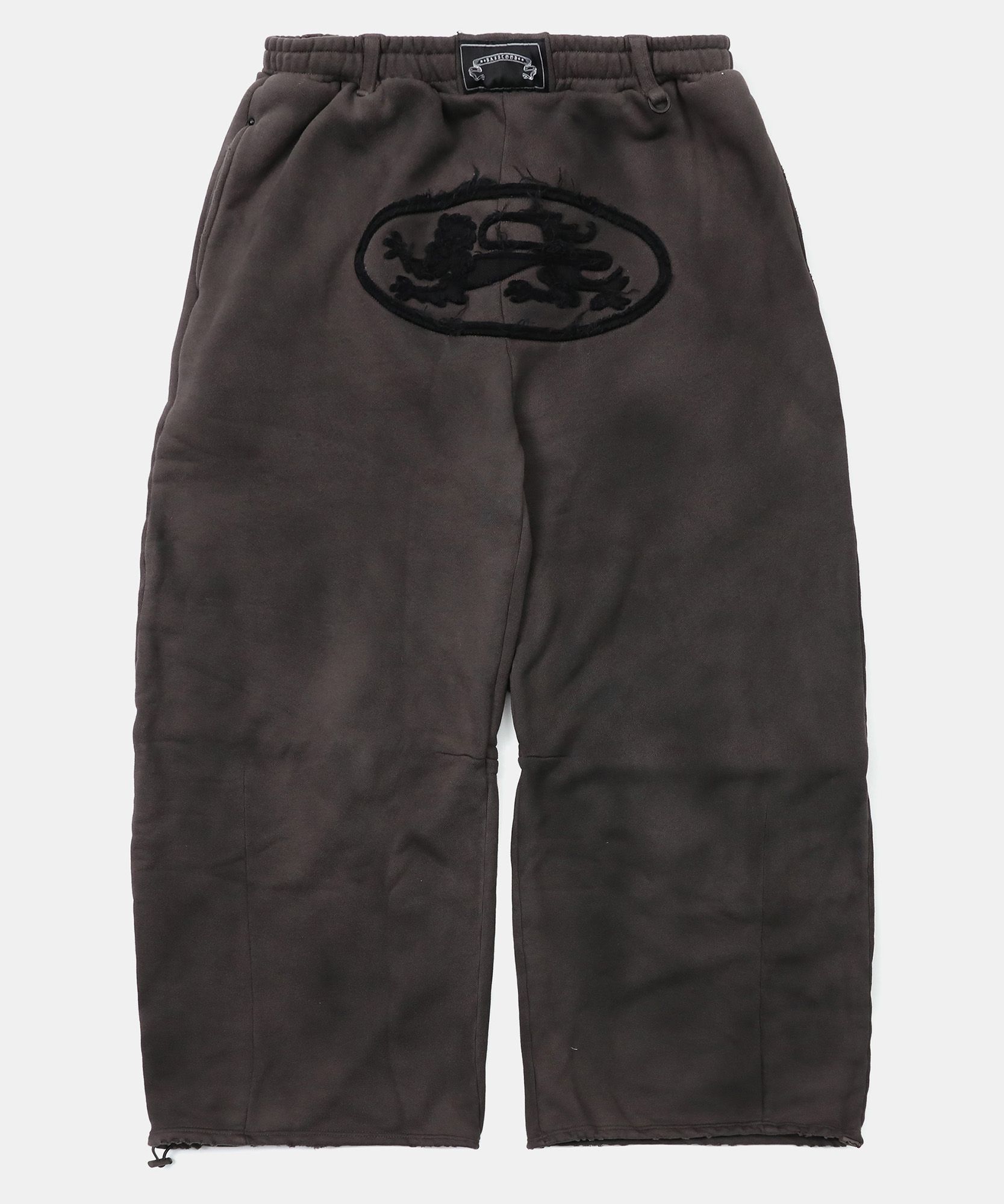 MUSINSA | BADBLOOD Lion Patch 2 Way Curved Jogger - Charcoal