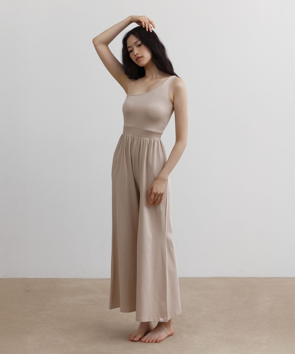 디야니(DHYANI) Citta one shoulder jumpsuit (Nudy glam)