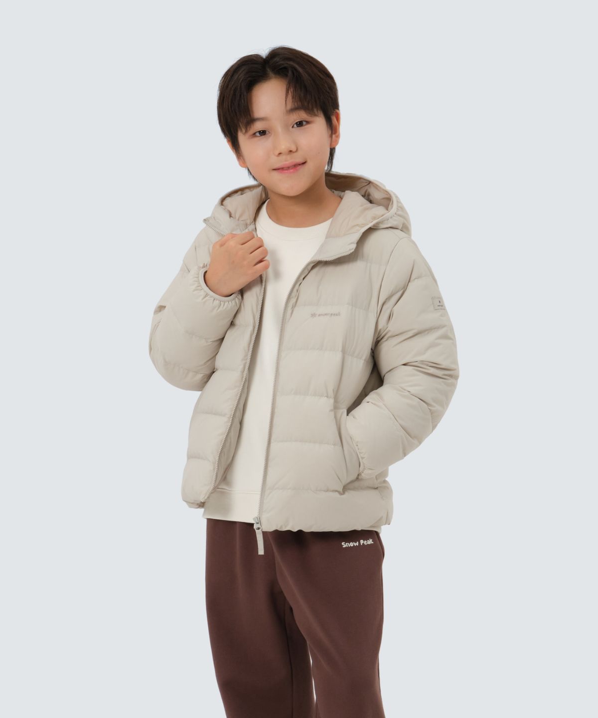 스노우피크 어패럴 키즈(SNOWPEAK APPAREL KIDS) 키즈 랜드 후드 경량 다운 자켓 (S25WKFDJ82) Light Beige