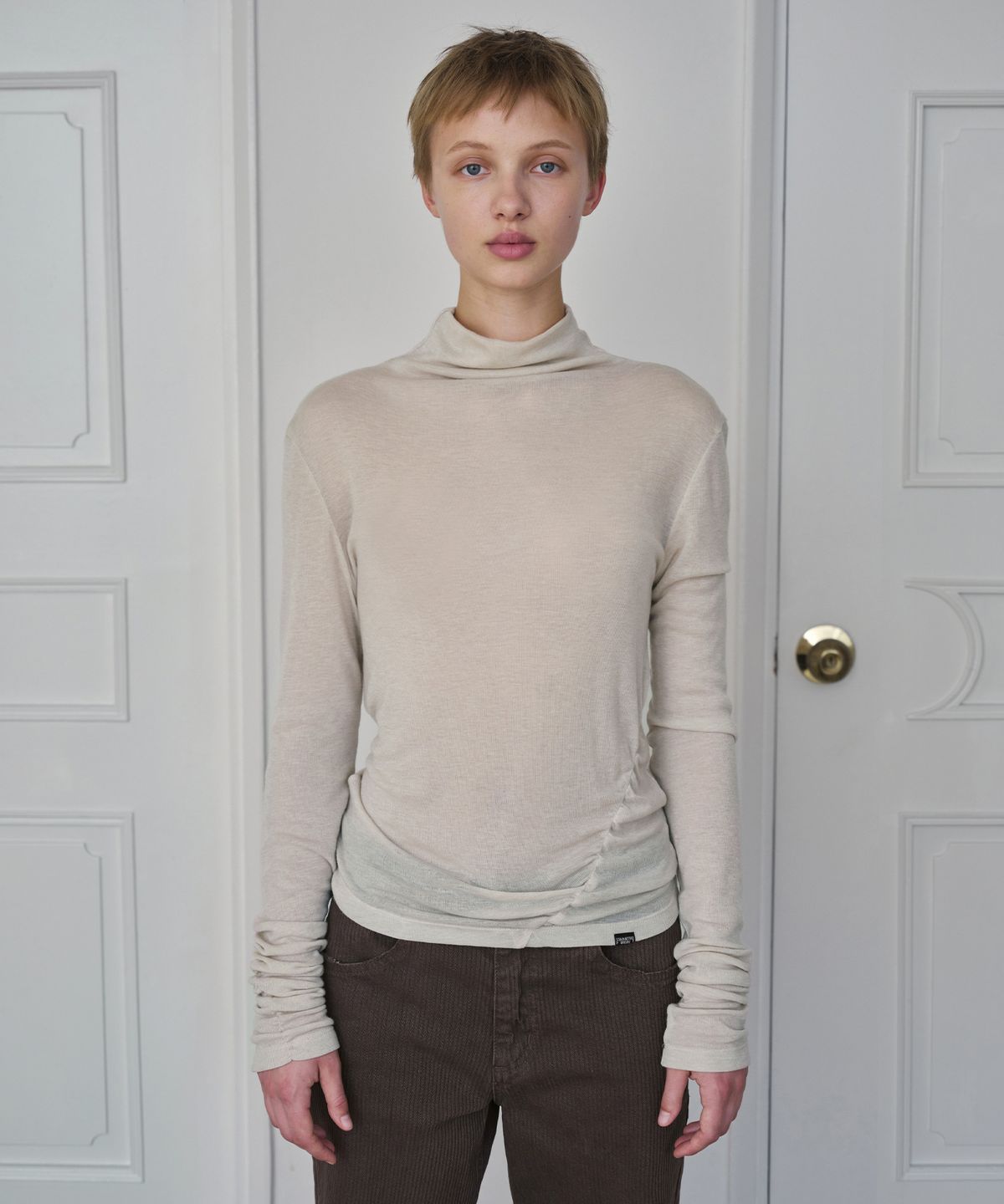 시메트릭 퍼센트(SYMMETRICPERCENT) Wool Turtleneck Top / Light Beige