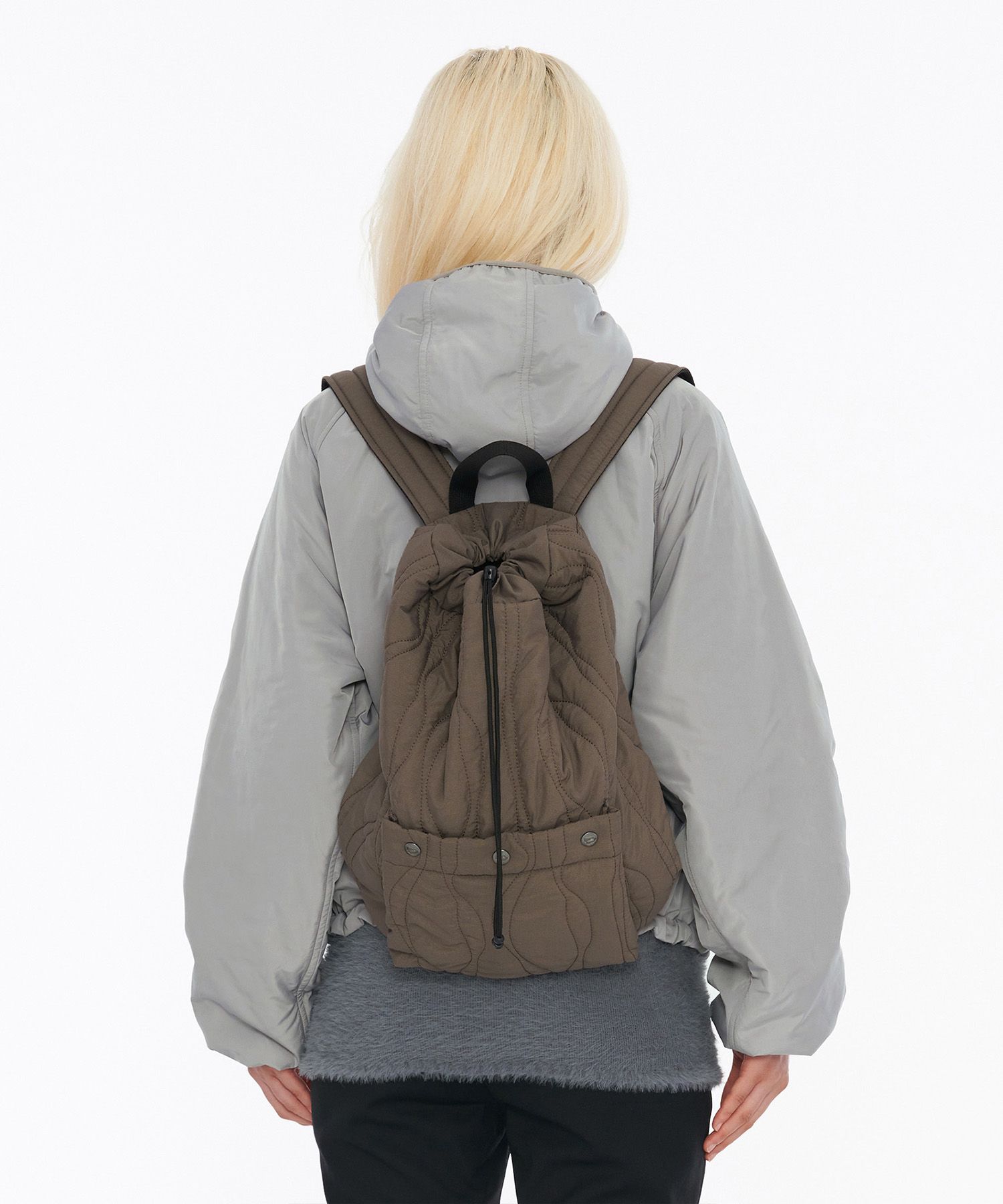MUSINSA公式 | WELLBEING EXPRESS Quilted String Backpack Brown