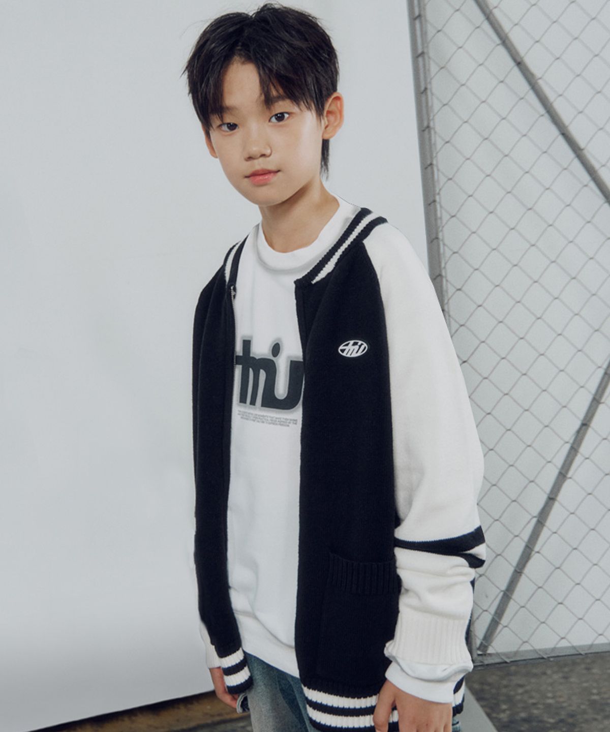 티미유(TMIU) 바시티 짚업 스웨터