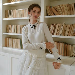 Cest_Line ribbon ruffle knit top