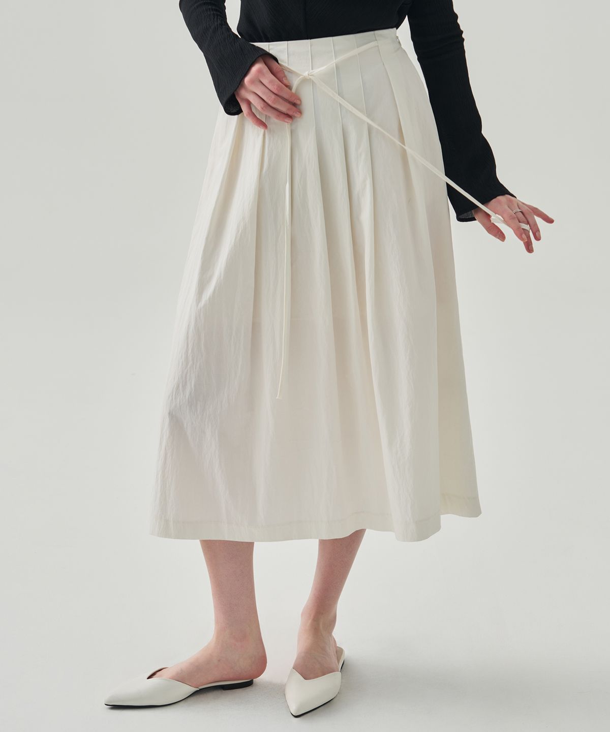 드로우핏 우먼(DRAWFIT WOMEN) 엘라 플리츠 롱 플레어 스커트 [IVORY]