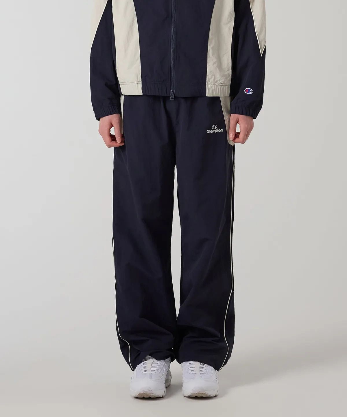 챔피온(CHAMPION) 트랙 로고 컬러블록 트랙 팬츠 Navy