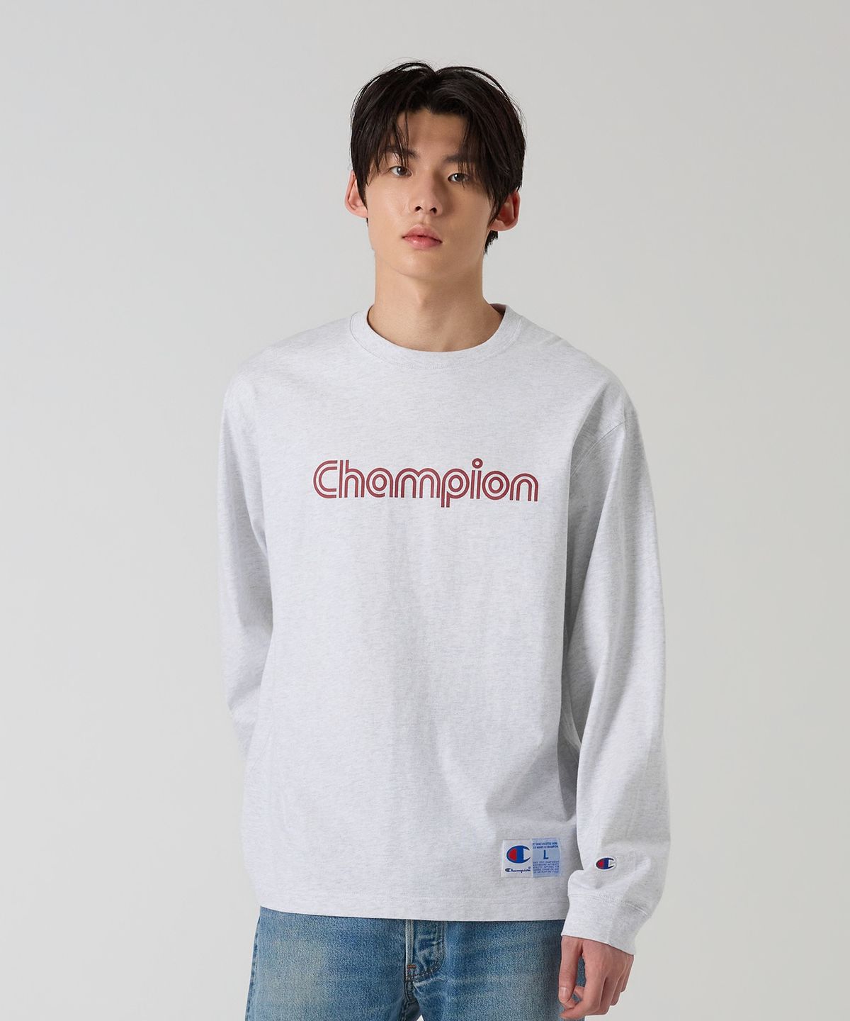 챔피온(CHAMPION) 트랙 로고 루즈핏 조그택 롱슬리브 티셔츠 Light Grey
