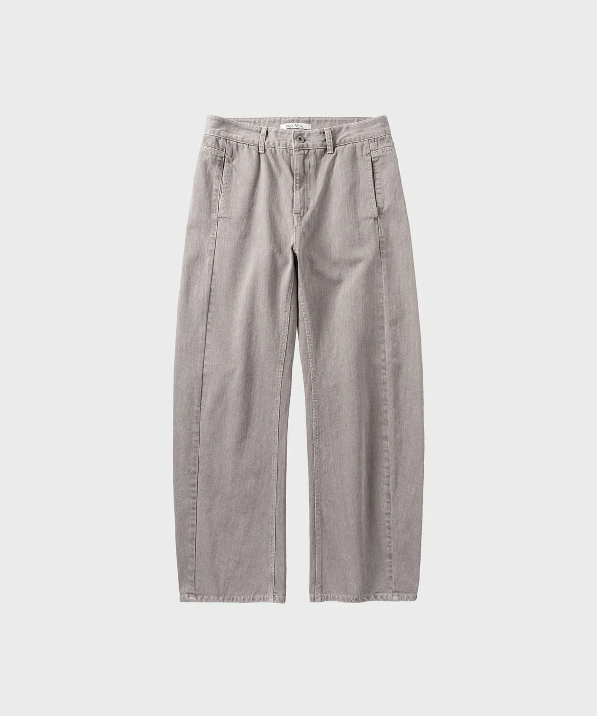 넌블랭크(NONBLANK) 가먼트 다잉 커브드 데님 팬츠_BEIGE