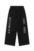 GERMAN LETTERING SWEATPANTS IN BLACK