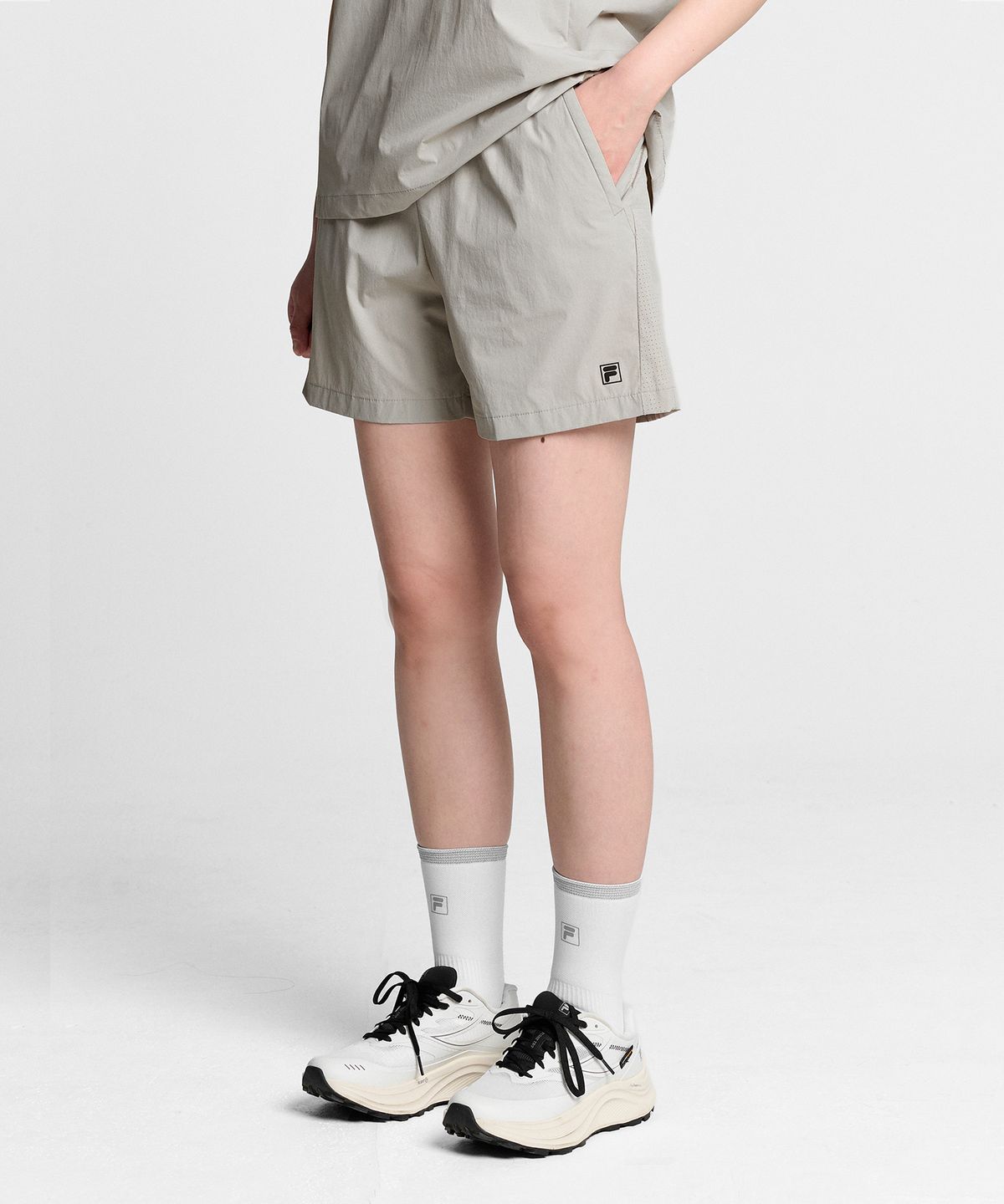 휠라(FILA) Coldwave+ 우븐 4.5부 쇼츠(FS262TR02U002021)