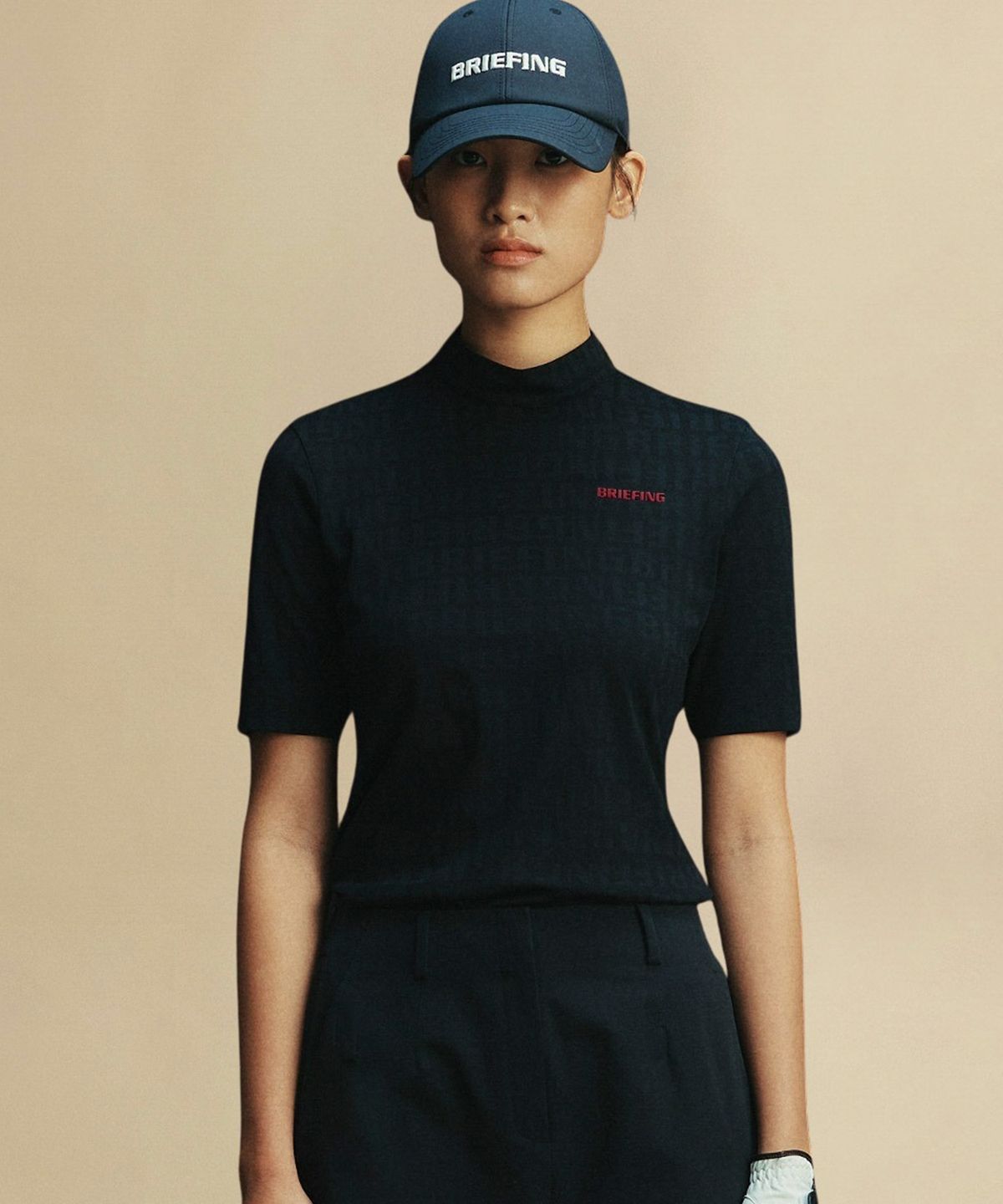 브리핑 골프(BRIEFING GOLF) 여자 로고 자가드 하이넥 숏슬리브_블랙