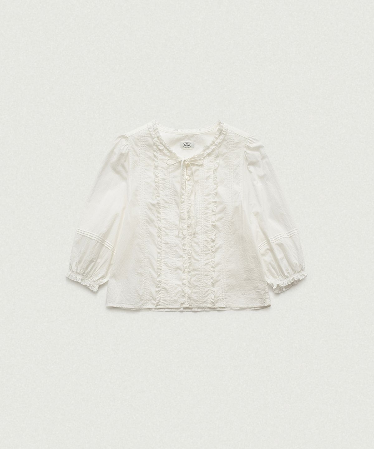 더바넷(THEBARNNET) Pevia Frill Pintuck Blouse