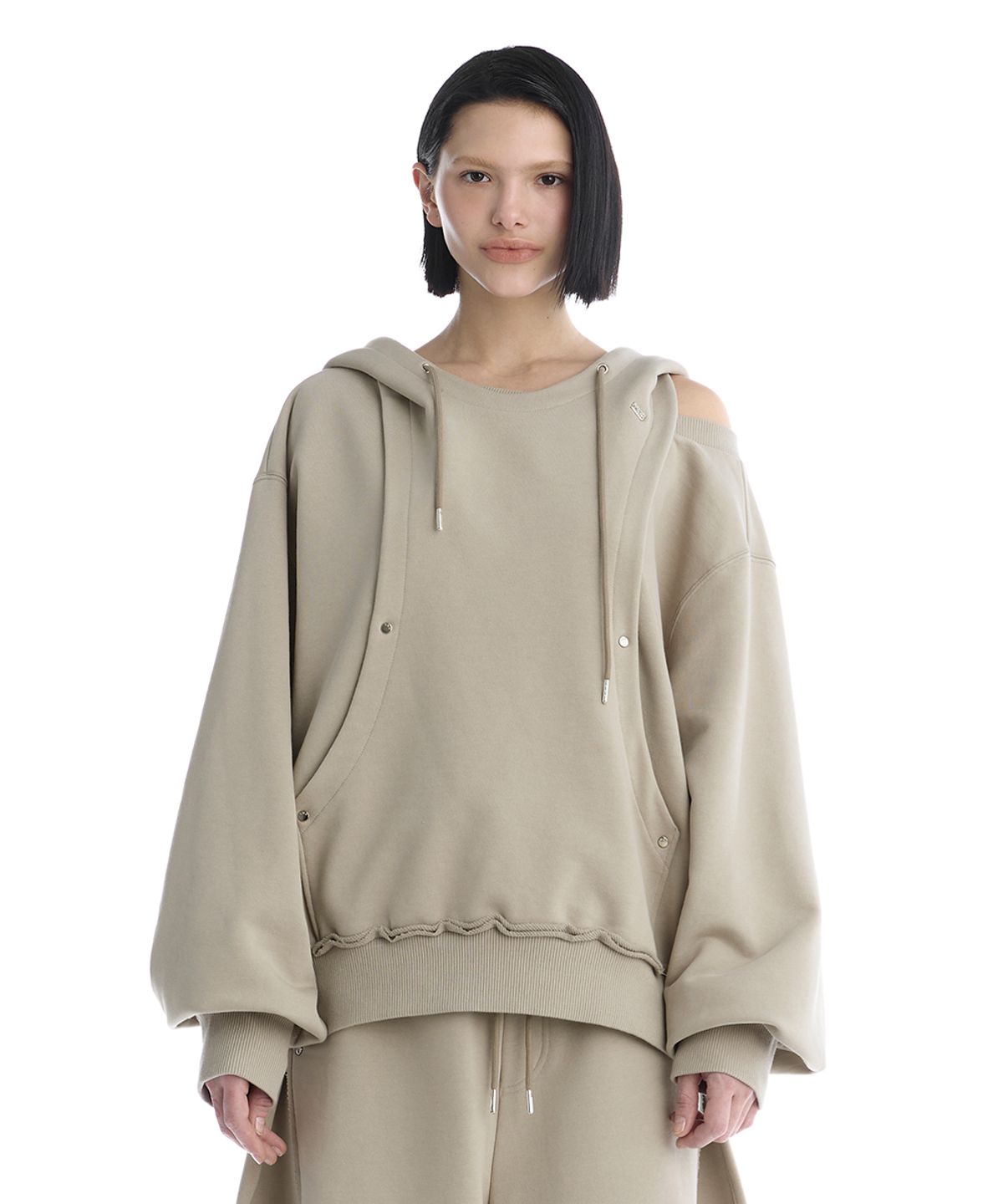 트리밍버드(TREEMINGBIRD) TMB One-Shoulder Raw Cut Set-Up Hoodie [ Beige ]