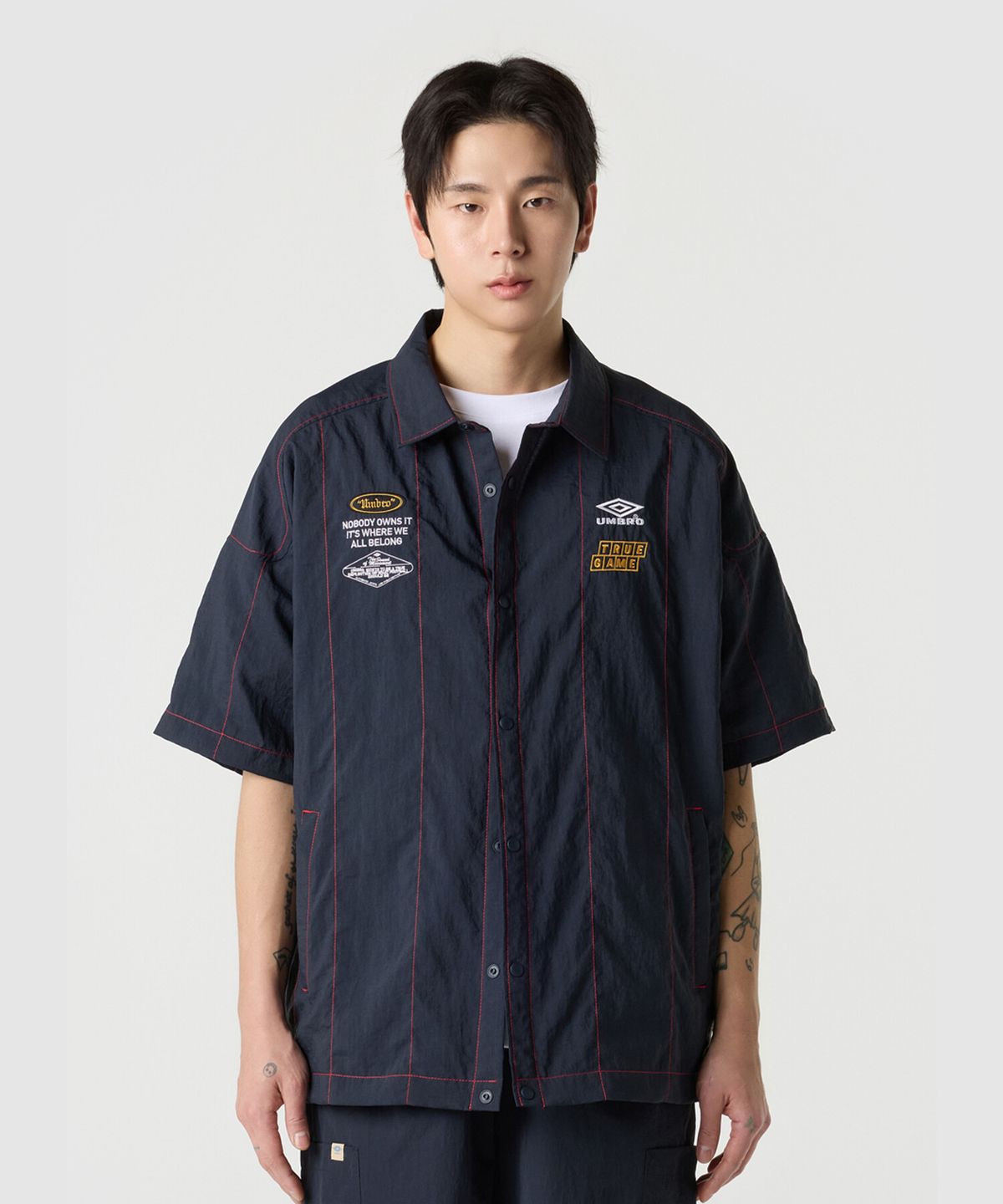 엄브로(UMBRO) 크리스피 타슬란 반팔 셔츠 네이비 UR221CJK58