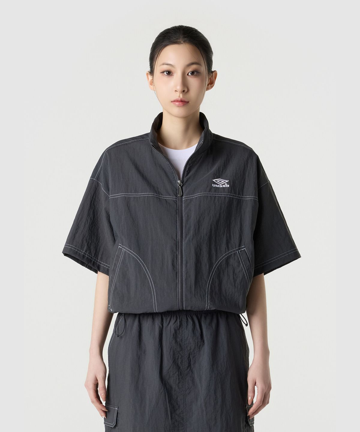 엄브로(UMBRO) 크리스피 타슬란 우먼스 반팔 풀집 자켓 차콜 UR222CJK57