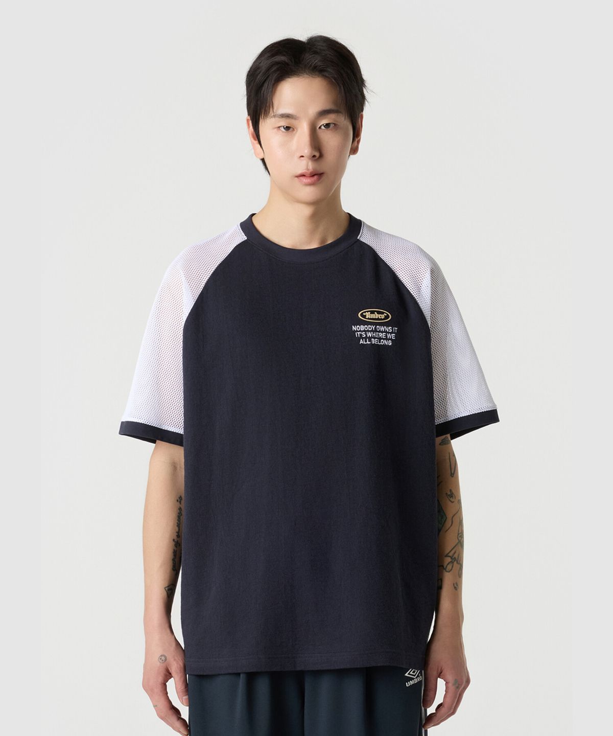 엄브로(UMBRO) 크리스피 타슬란 메쉬 하이브리드 반팔 티셔츠 네이비 UR211CRS50