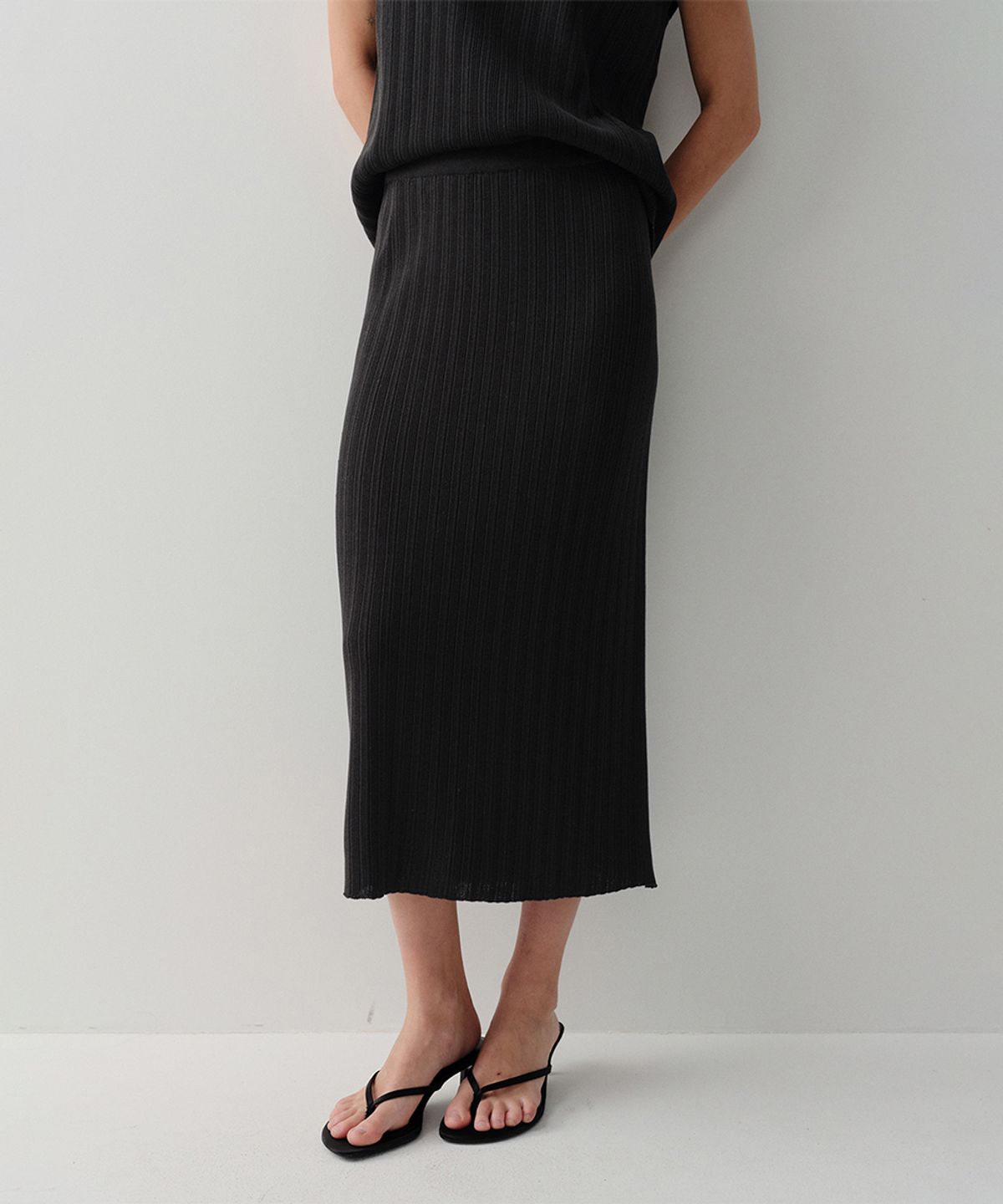 이아(EAAH) MOI PLEATS KNIT SKIRT (BLACK)