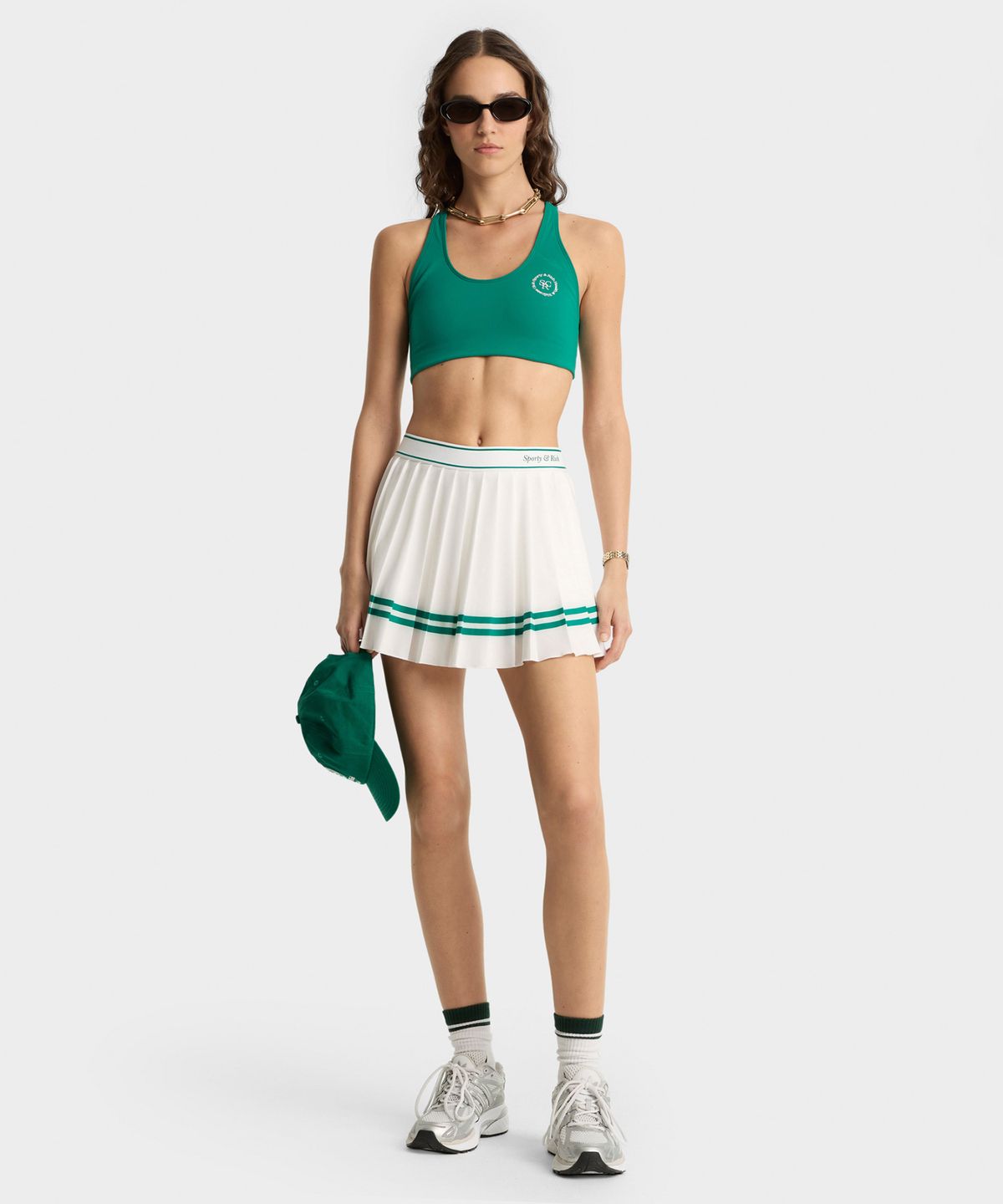 스포티앤리치(SPORTY&RICH) 이탤릭 로고 플리츠 스커트 R255AWS001
